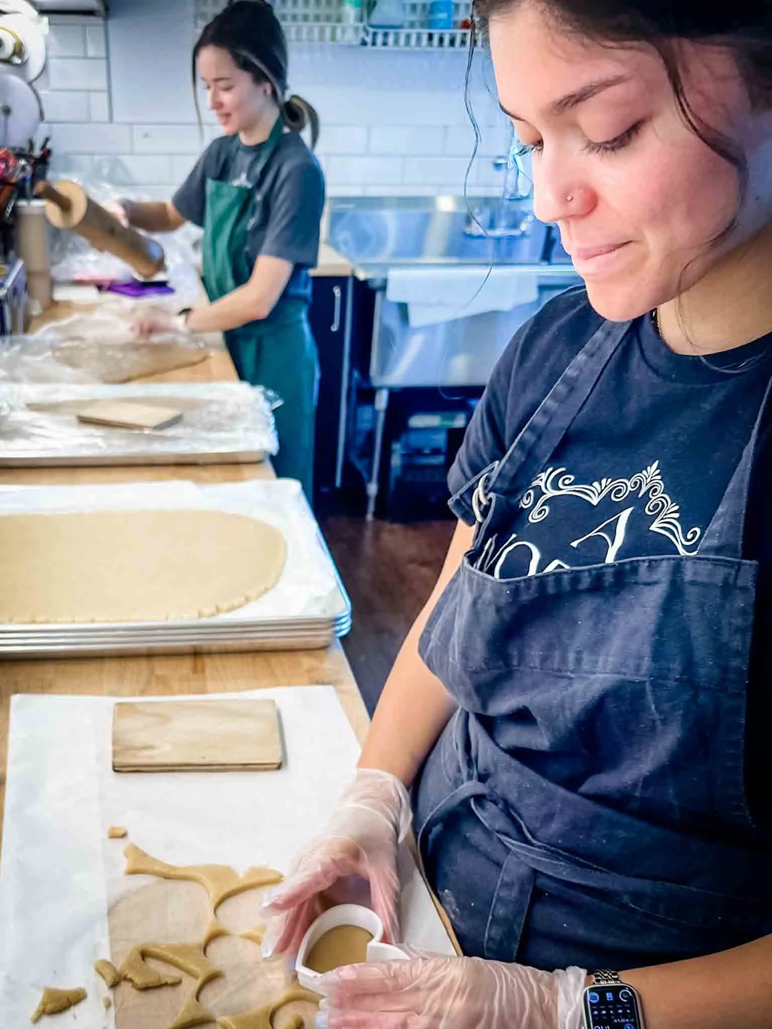 A Worthy Cookie close up of ladies cutting sugar cookies.jpg