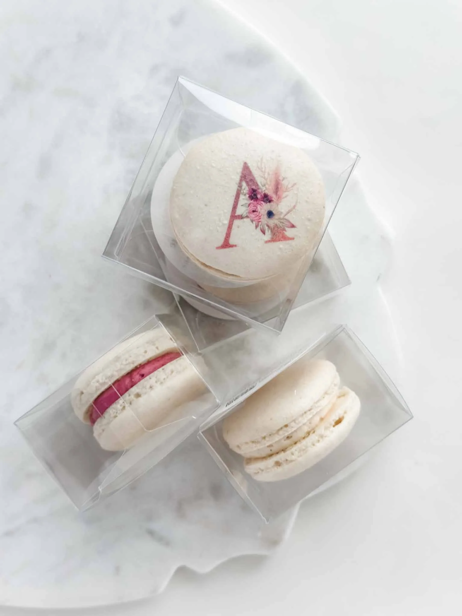 A Worthy Cookie custom macarons with baptism for a baby girl.jpg