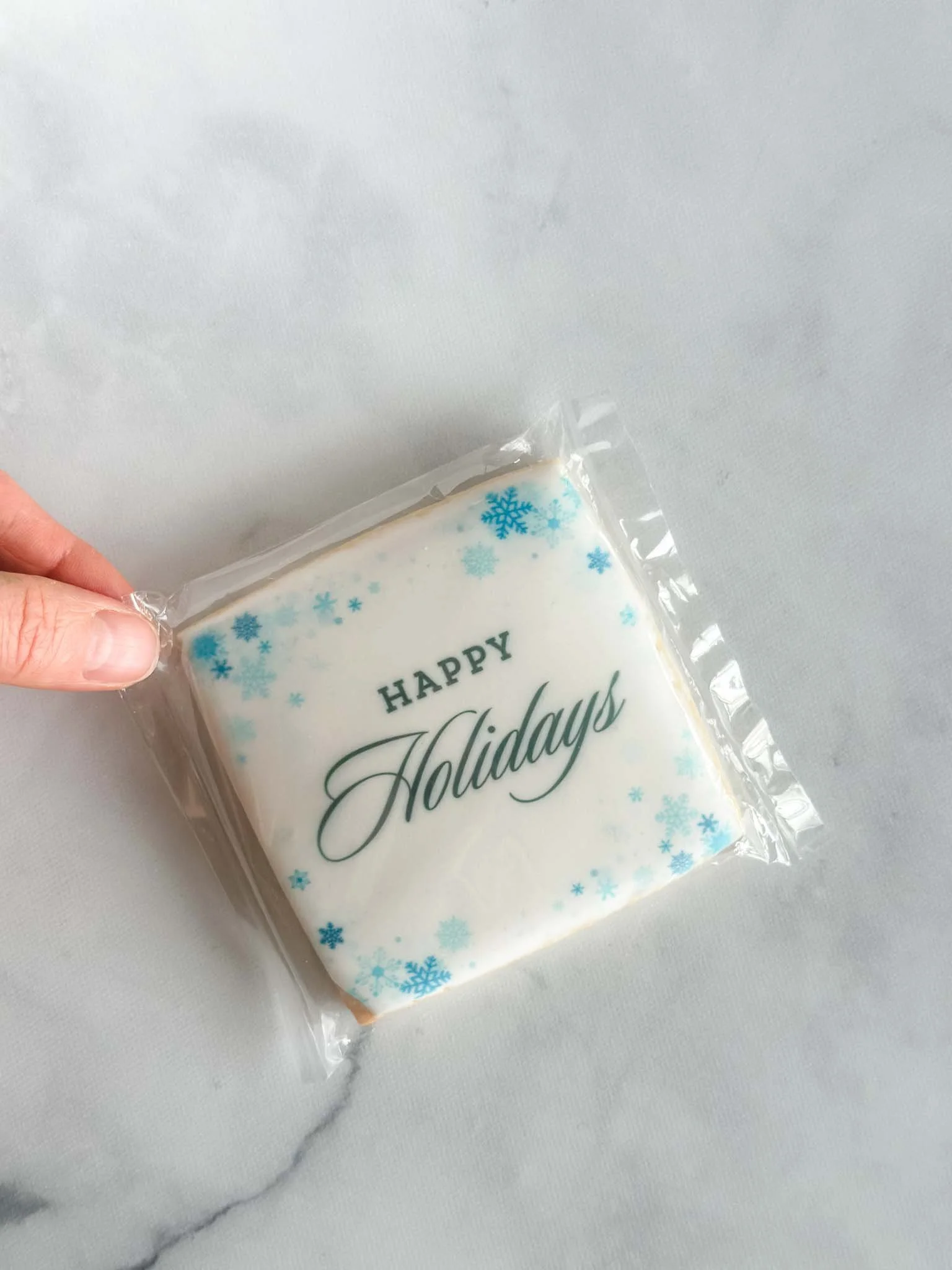 A Worthy Cookie Happy Holidays individually bagged Large sugar cookie with snowflake border.jpg