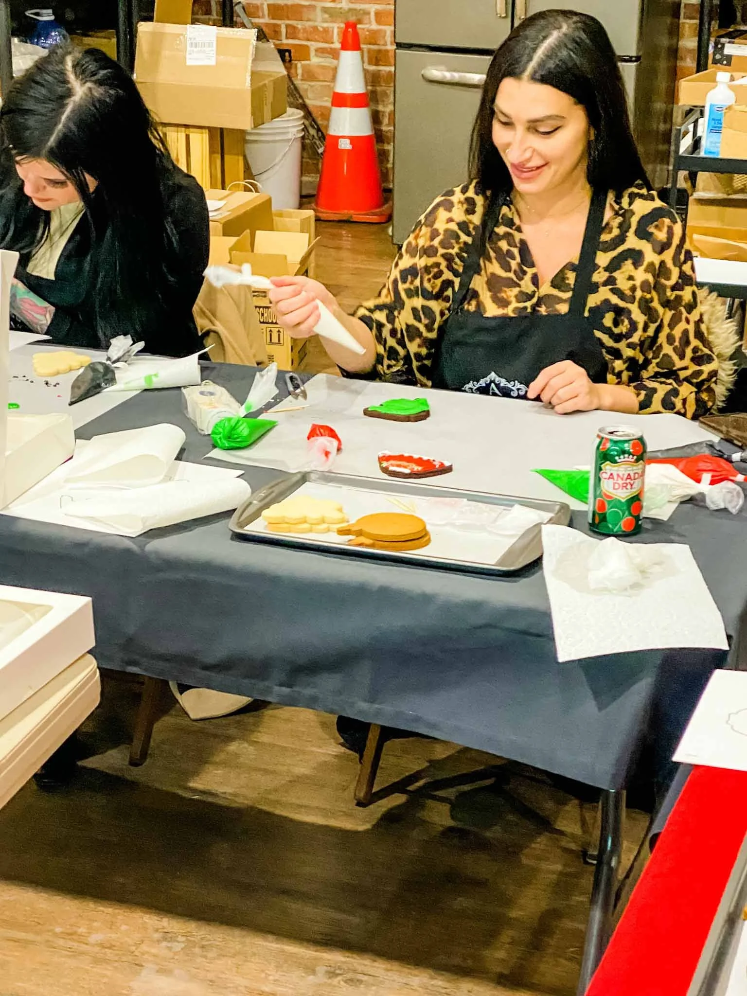 A Worthy Cookie Sugar Cookie decorting class lady decorating green.jpg