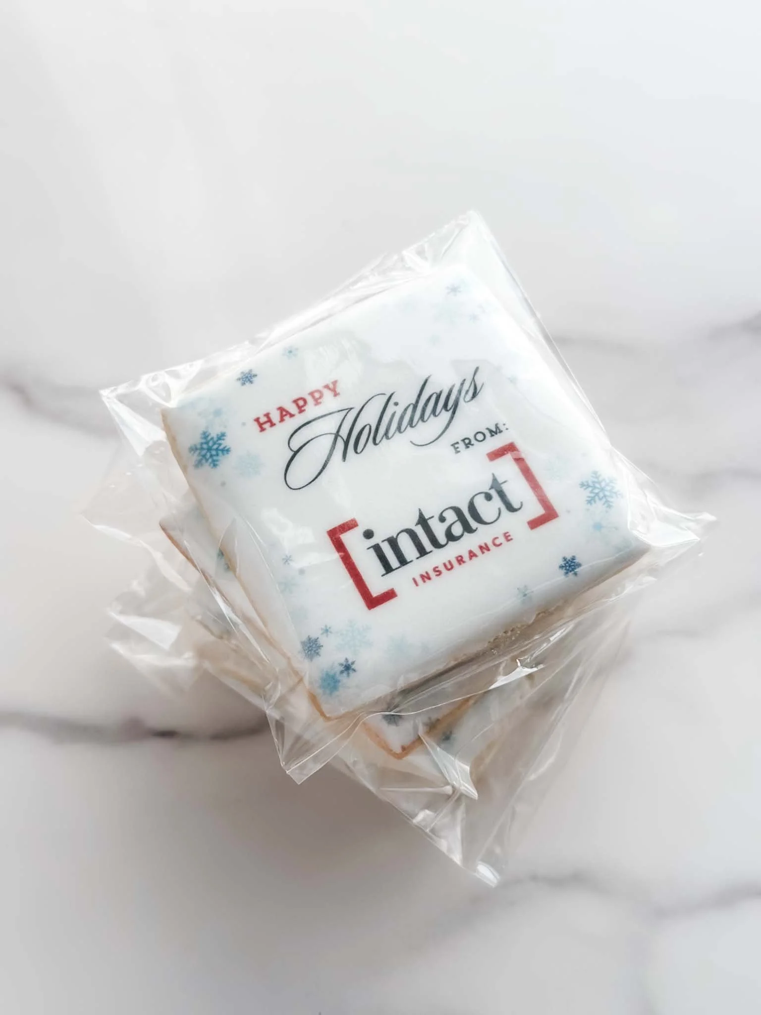 Individually packaged Intact Insurance branded holiday sugar cookie