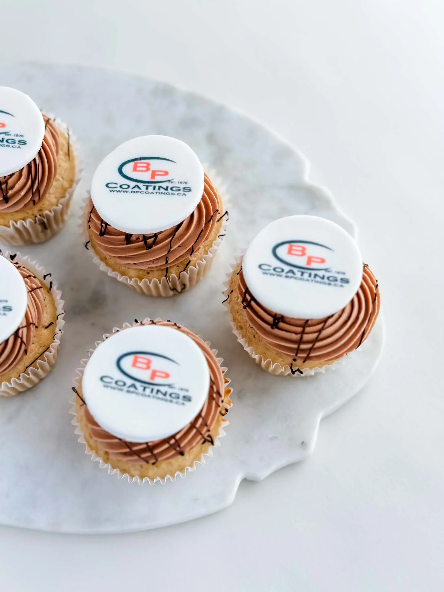 A Worthy Cookie custom cupcakes with branded logo vanilla chocloate.jpg