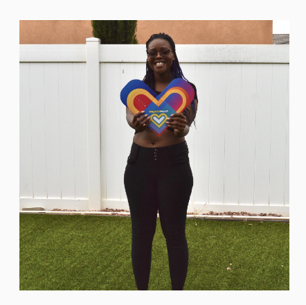  A person holds a paper heart. 