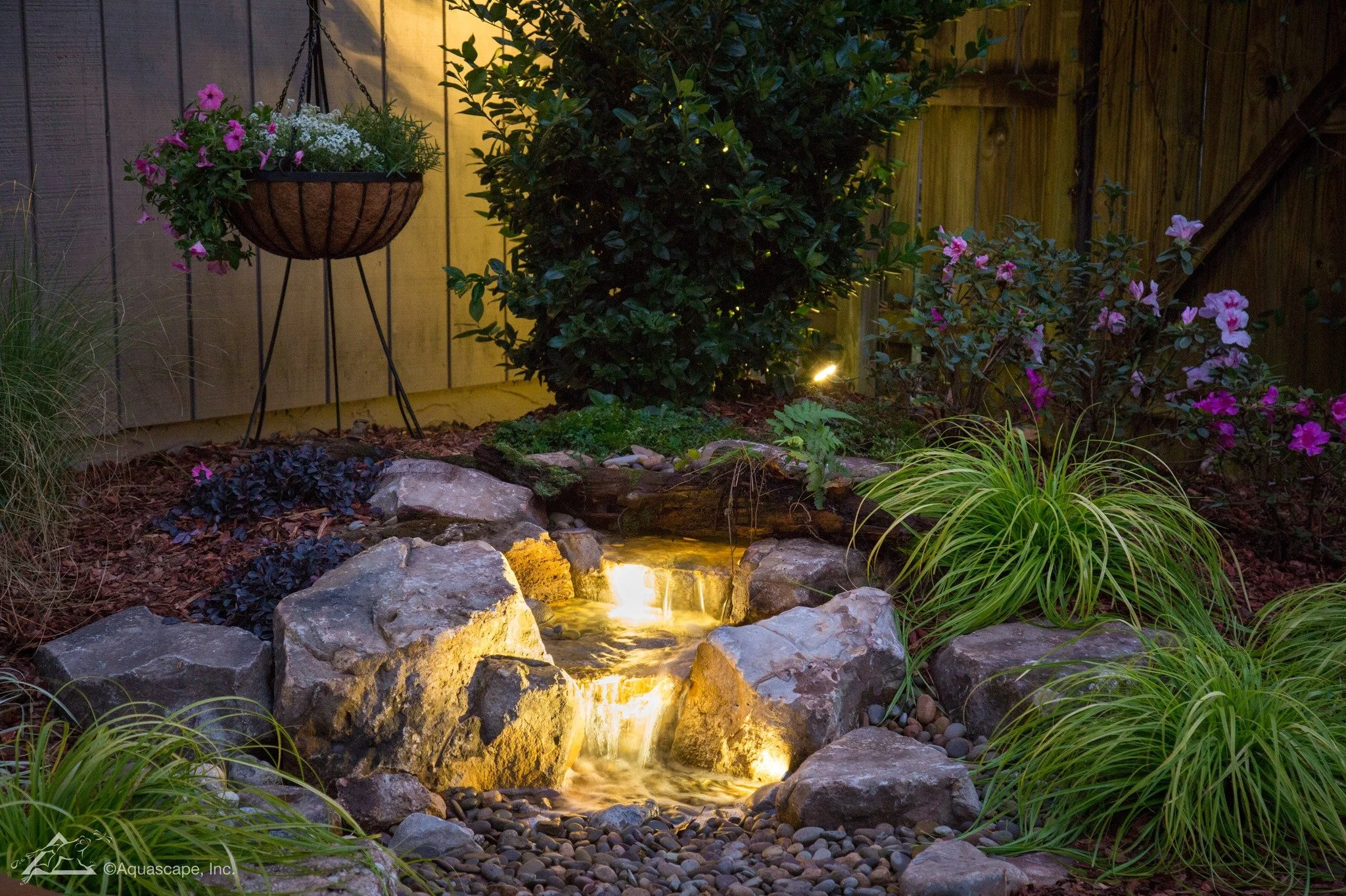 When the sun goes down, the magic turns on. ✨

Our custom pondless waterfalls come alive at night with soft, professional lighting that makes the water shimmer and your whole yard glow.

No standing pond.
Low maintenance.
Just the sound of cascading 