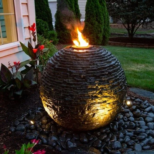 Elevate your outdoor space with the element of contrast.

Our custom sphere fountain blends flowing water with a live fire feature &mdash; a striking balance of calm and energy in one sculptural statement.

The gentle sound of water softens the glow 