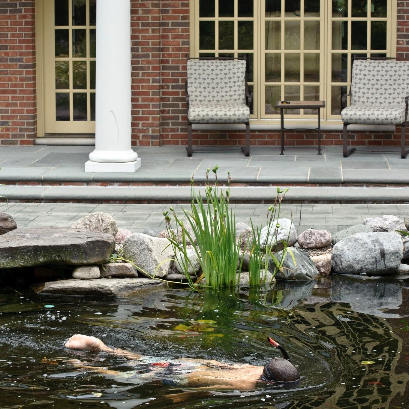 What if your backyard could cool you off this summer&hellip; without a traditional pool?

Imagine stepping into clear, naturally filtered water, surrounded by stone, plants, and gentle waterfalls. Fish glide beneath the surface while kids float, spla