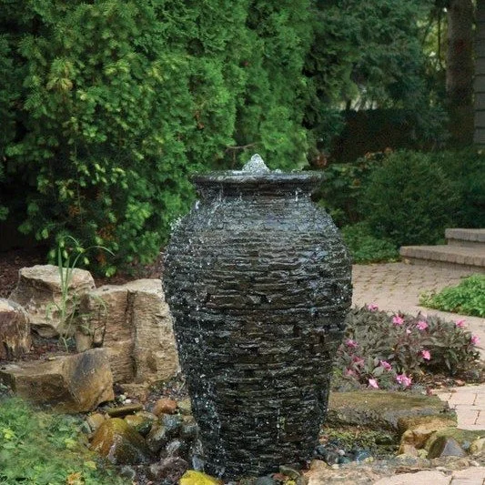 Want the sound and movement of water without a lot of upkeep?

A self-contained fountain like this is one of the simplest ways to bring peaceful moving water into your yard.

Because there is no open pond, there is much less surface area to collect l