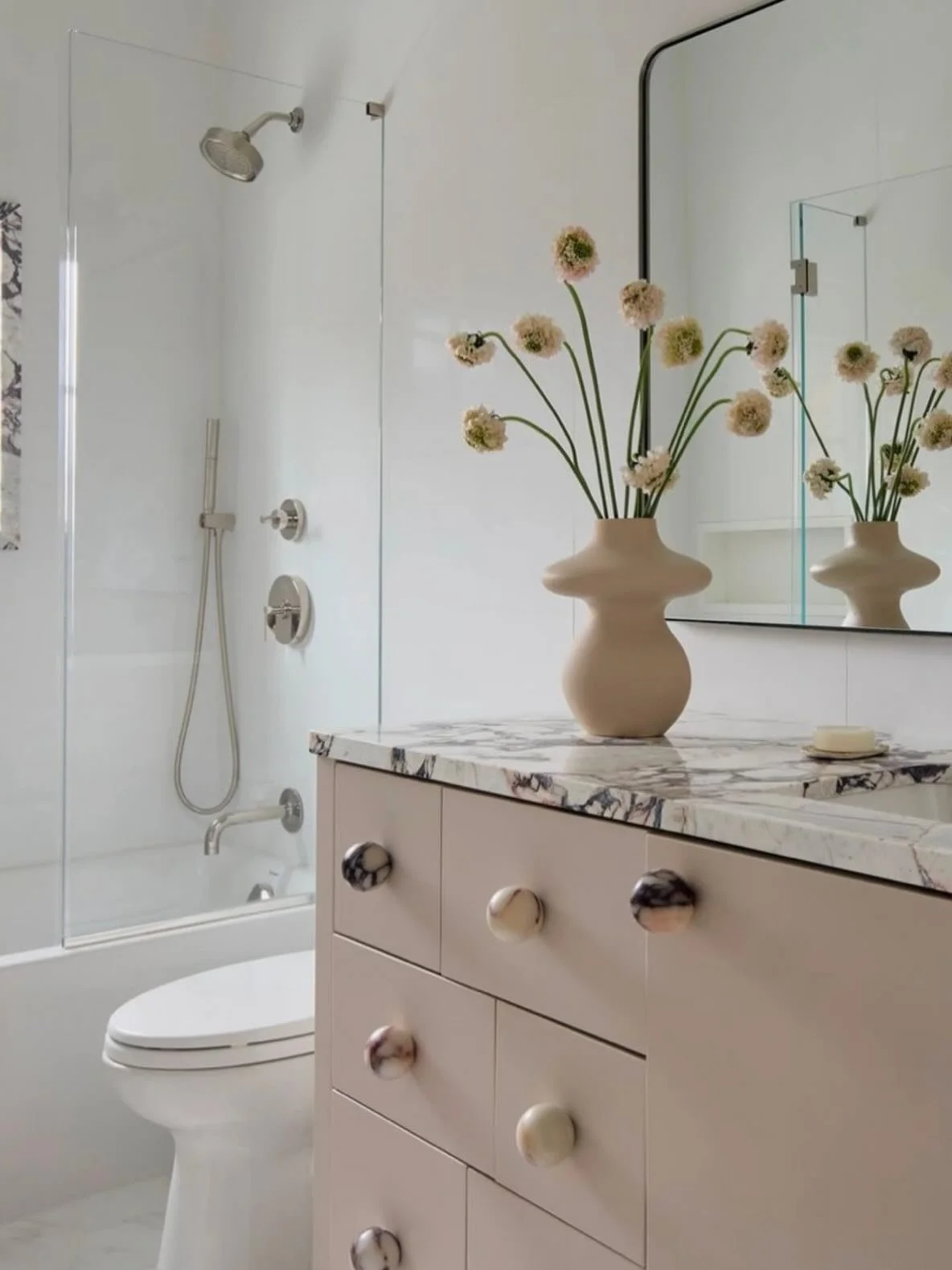 Proof that soft doesn&rsquo;t mean boring 🤍

A muted cabinet tone + a standout stone top = the perfect balance.

Image sourced from @pinterest 

#bathroomrenovations #bathroomdesigns #interiordesigner #interiorstyling #softpink