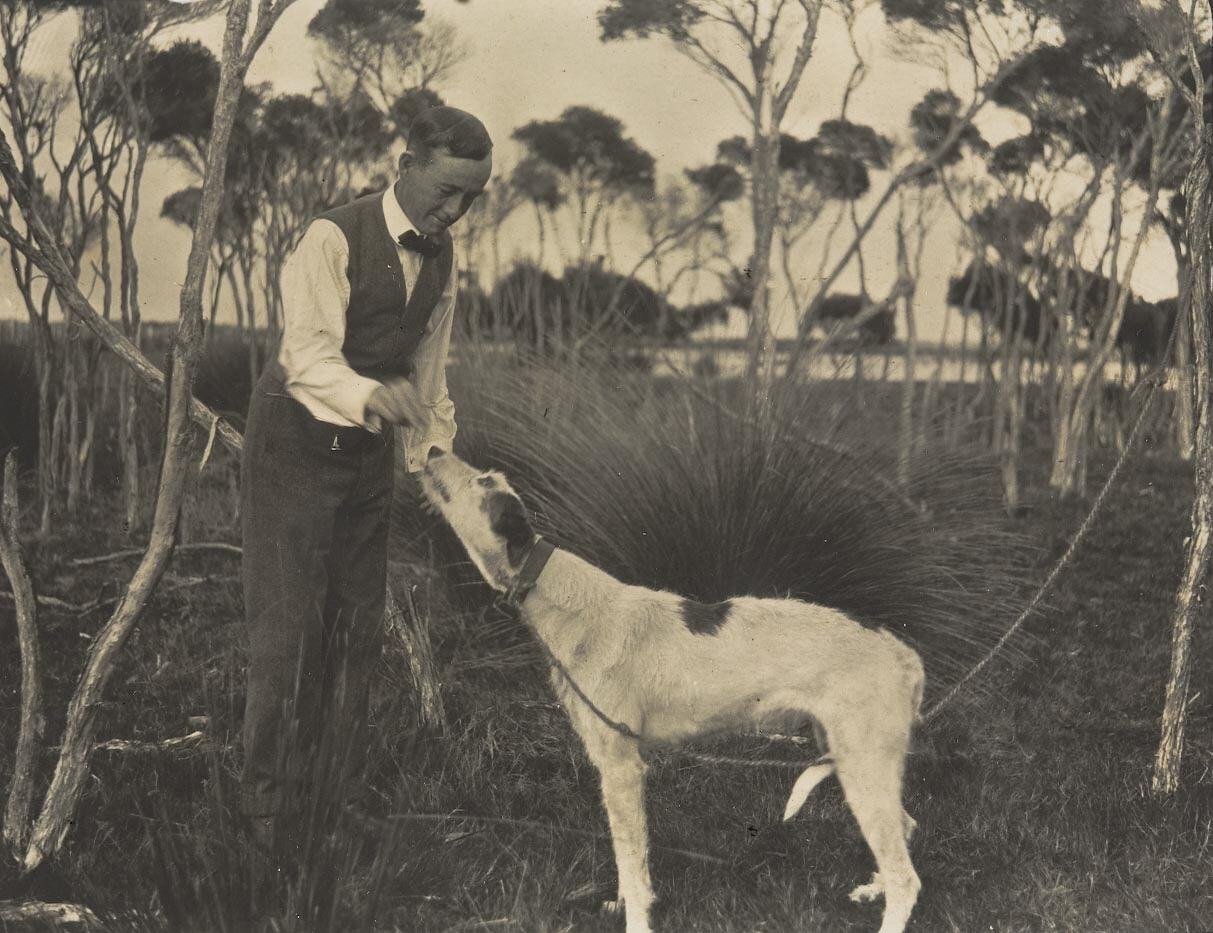 Charles Nuttall Feeding 'Kangaroo' Dog