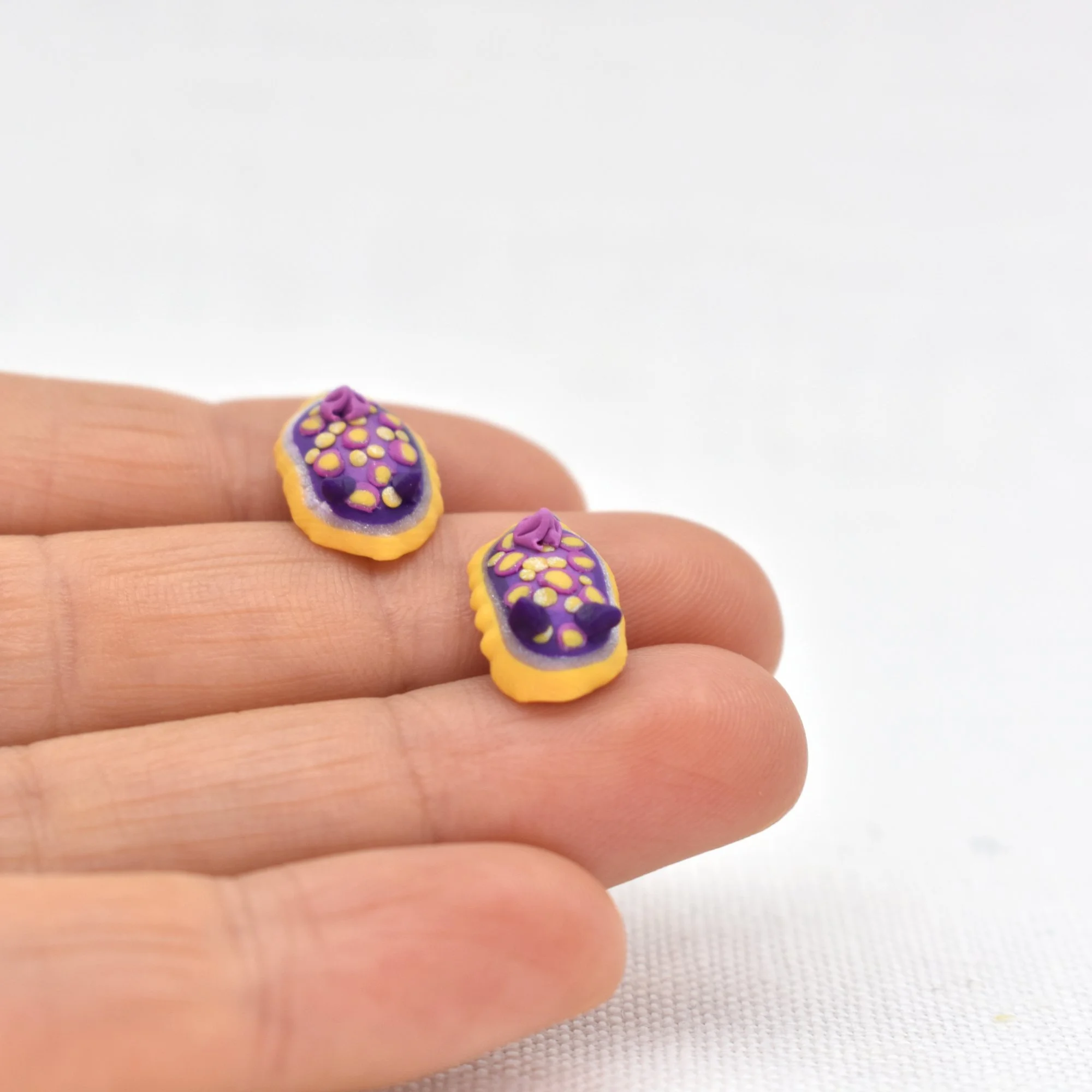Felimidia_luteorosa_earrings_4.jpg