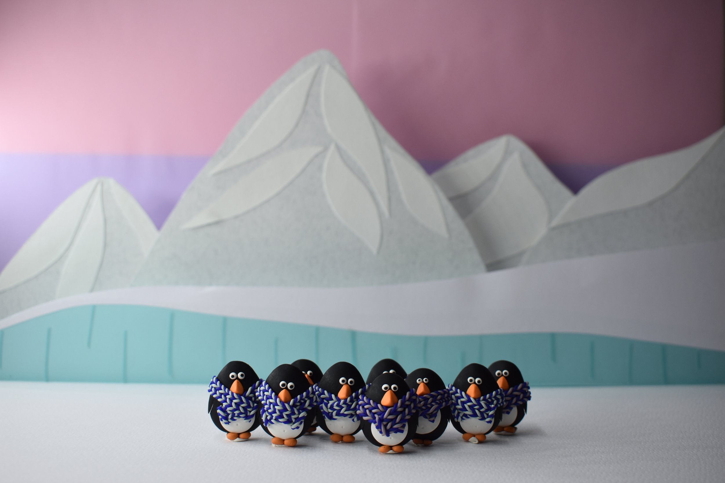 Penguins huddling together after a blizzard.