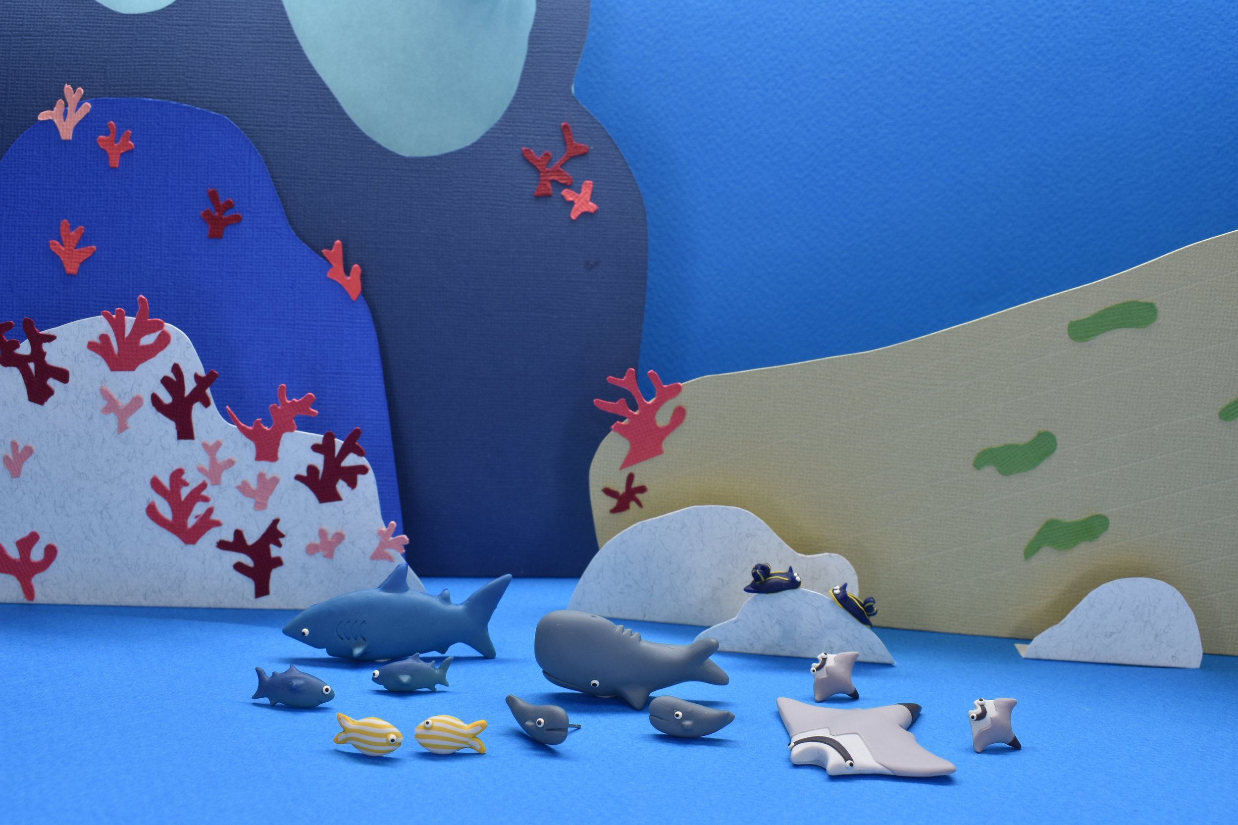 Azores underwater collection in its habitat. Brooches and earrings featuring blue sharks, sperm whales, devil fish, goldline fish and Azorica nudibranch.