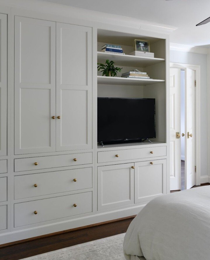 To gain space in the master bathroom at the #CDScrosbyproject we took over a tiny master closet. So to compensate, we designed a pretty wall of builtins for clothes, and a tv for those Saturday mornings in bed. Cabinetry from CDS Cabinet Co.⁠
 📷️: @