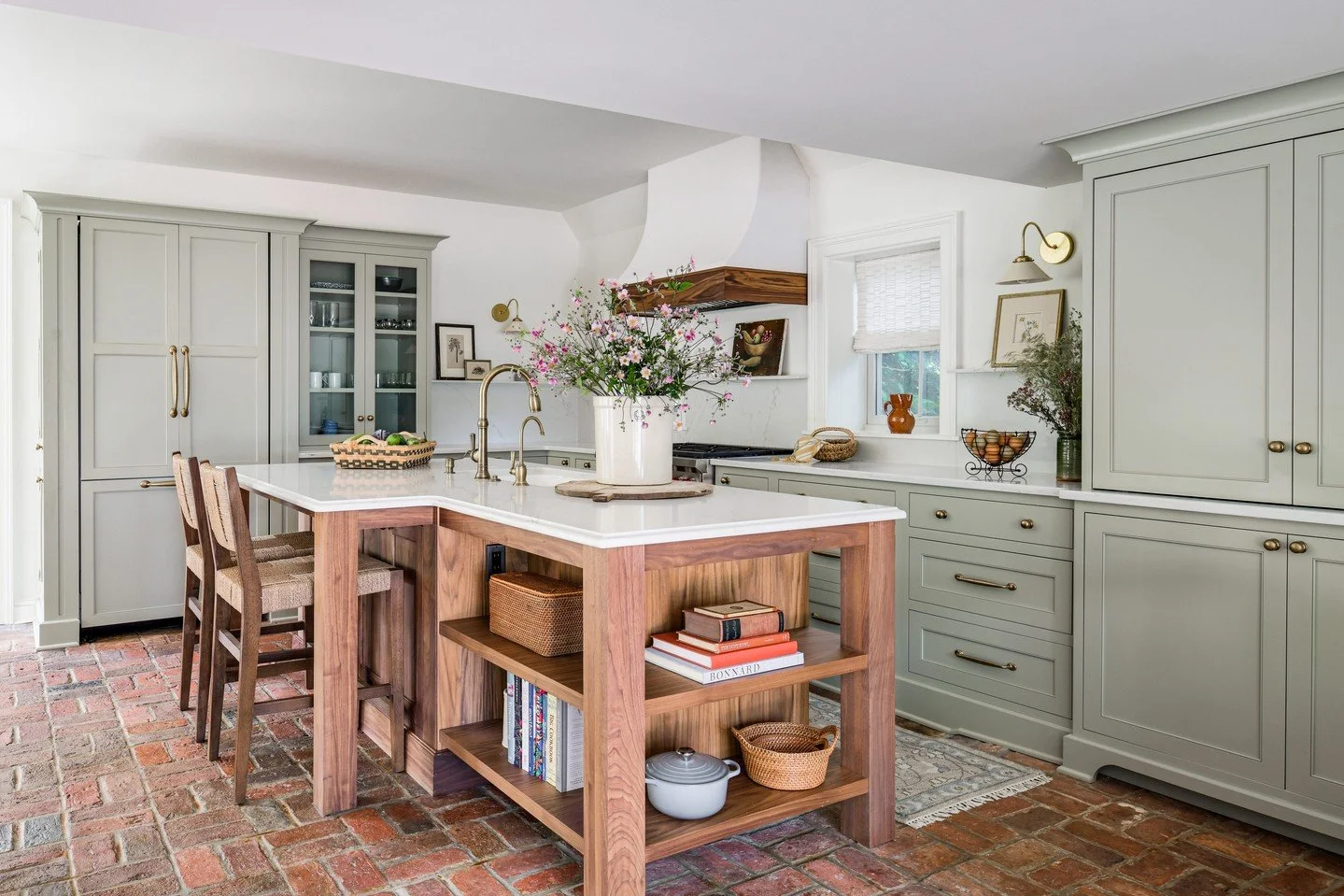 That time we designed a kitchen and adjoining sitting room for a circa 1800's home in the heart of Clifton, Virginia with multiple ceiling heights, a narrow walkway near the stairs, two fireplaces and the original brick flooring. We'd say it turned o