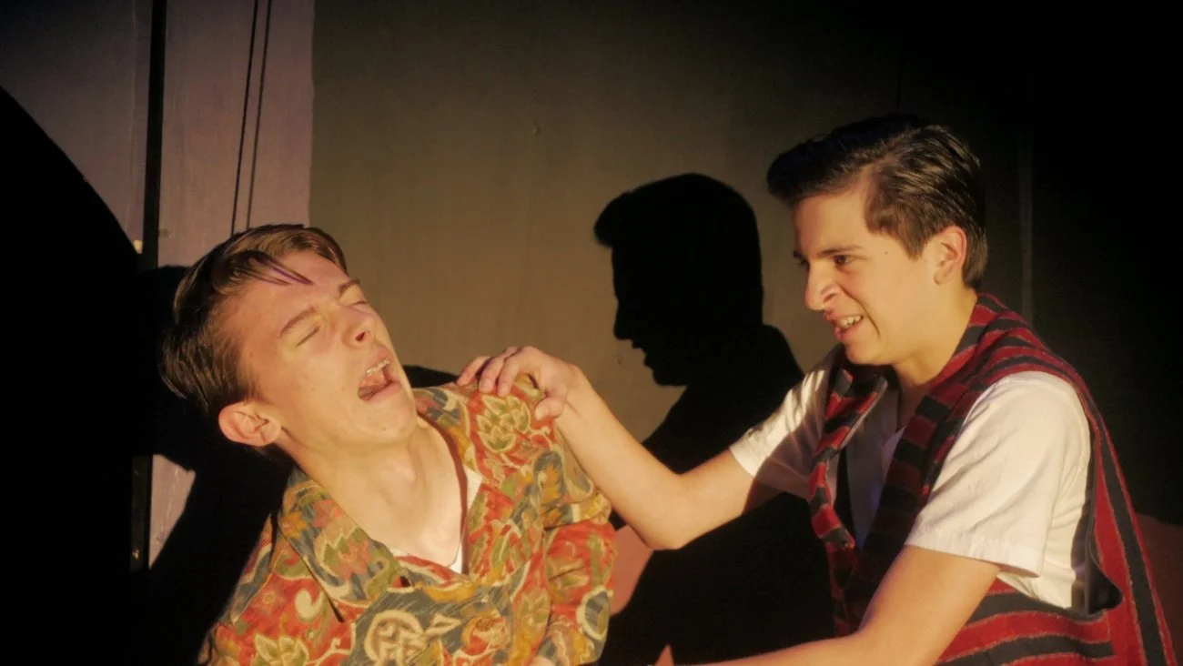 Felix David stage stabbing Jaden Williams in Jax Schuck's production of Rosencrantz and Guildenstern Are Dead.