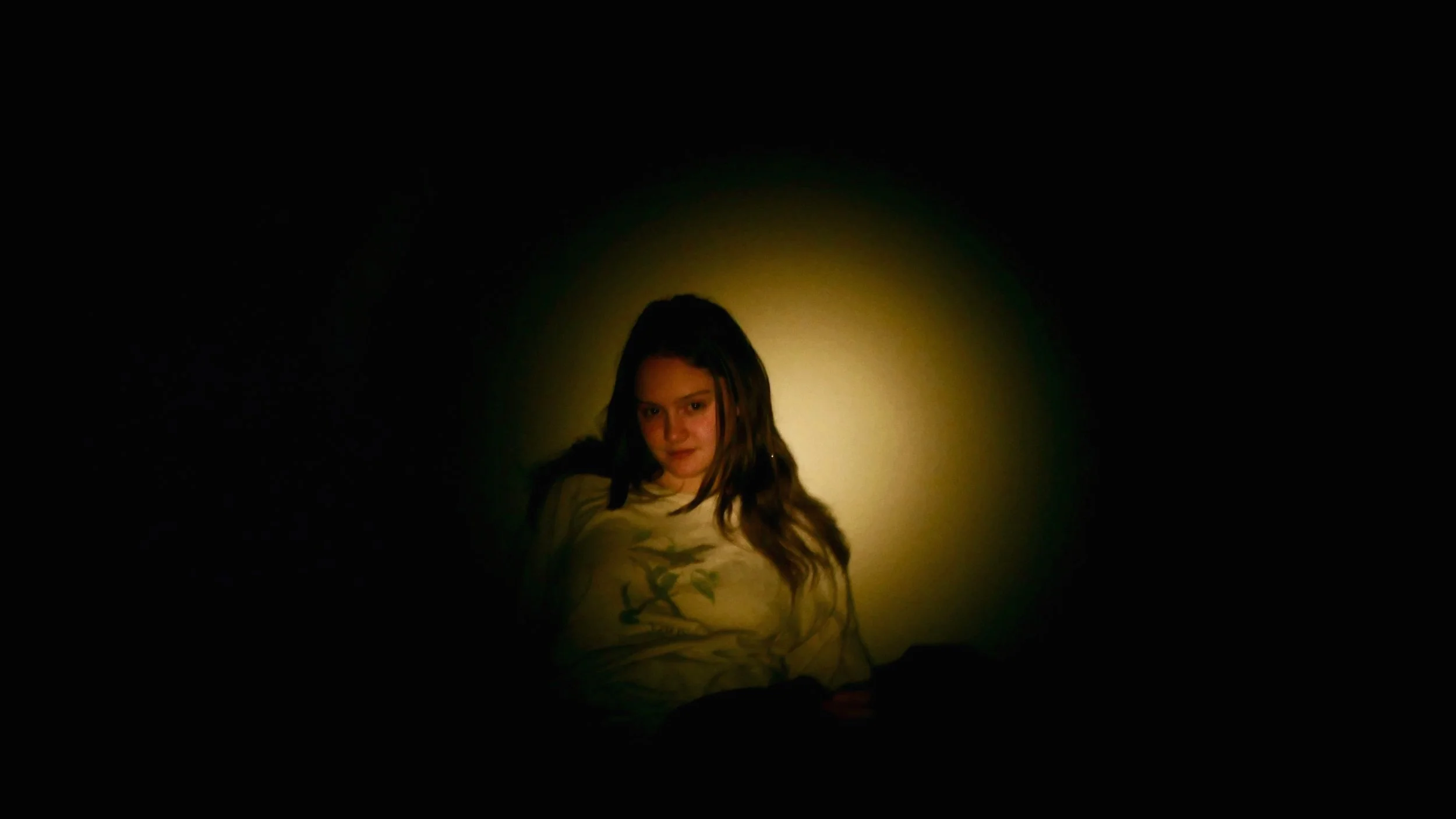 Carly Geary in a yellow spotlight