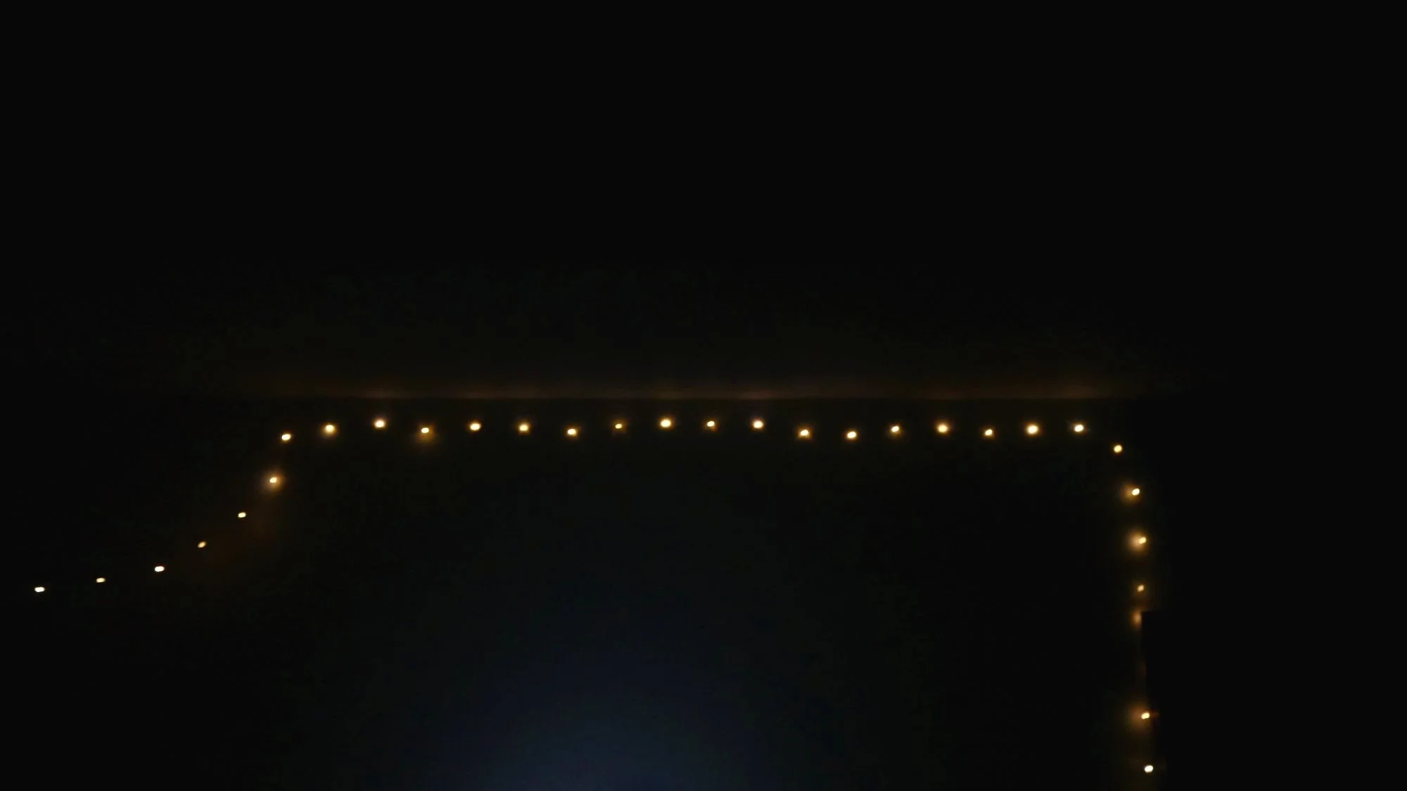 Fair lights on a dark wall.
