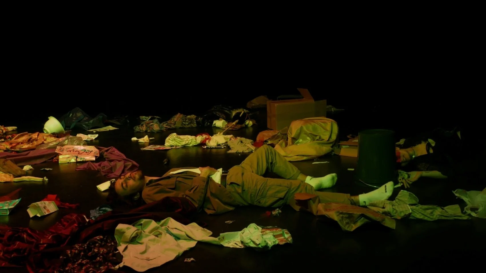 Aaron Sullivan lying on the ground in Jax Schuck's production of Cowboy Mouth.