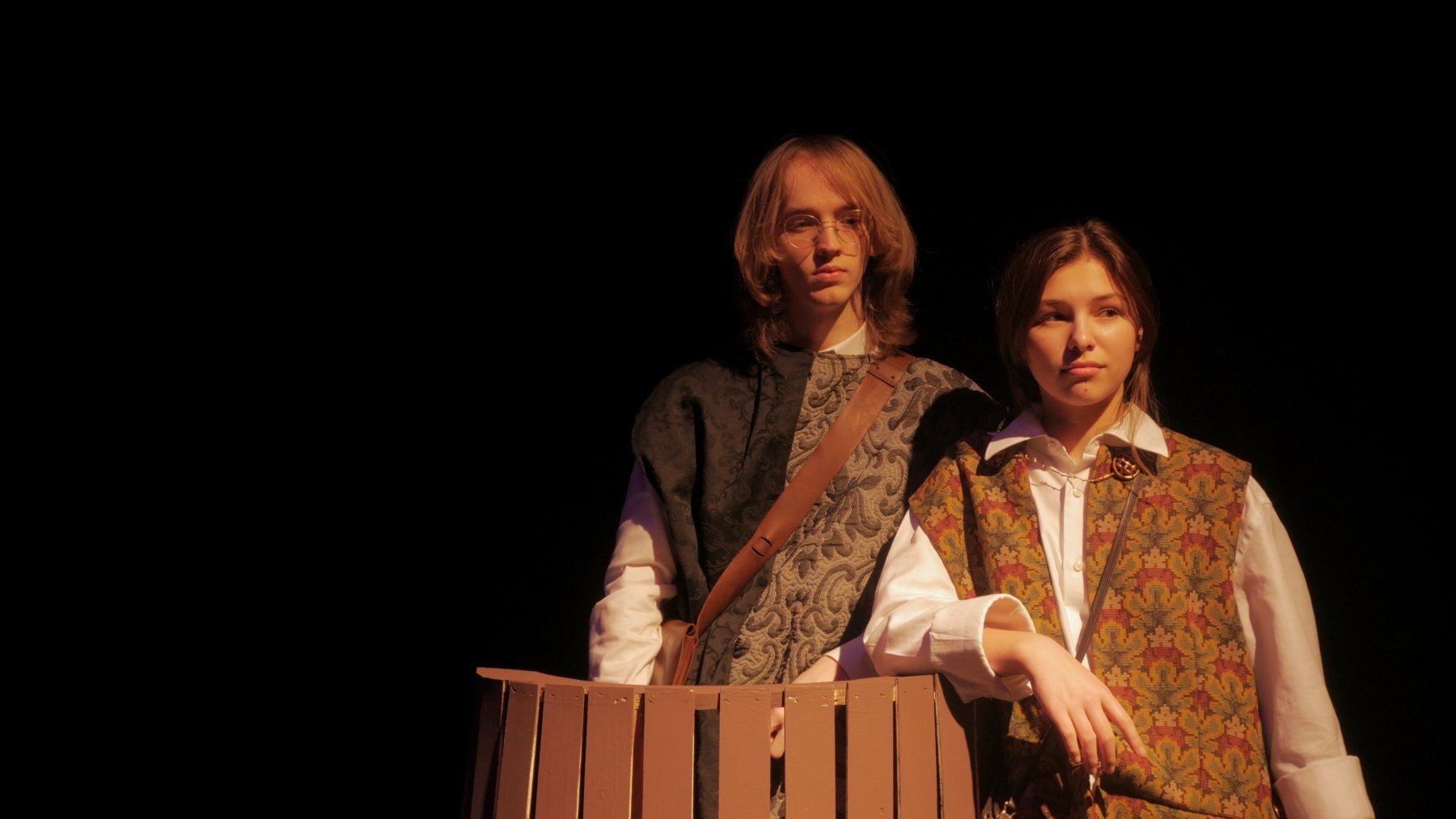 Blake Kump in a bucket and Avery Barstand standing nearby in Jax Schuck's production of Rosencrantz and Guildenstern Are Dead.