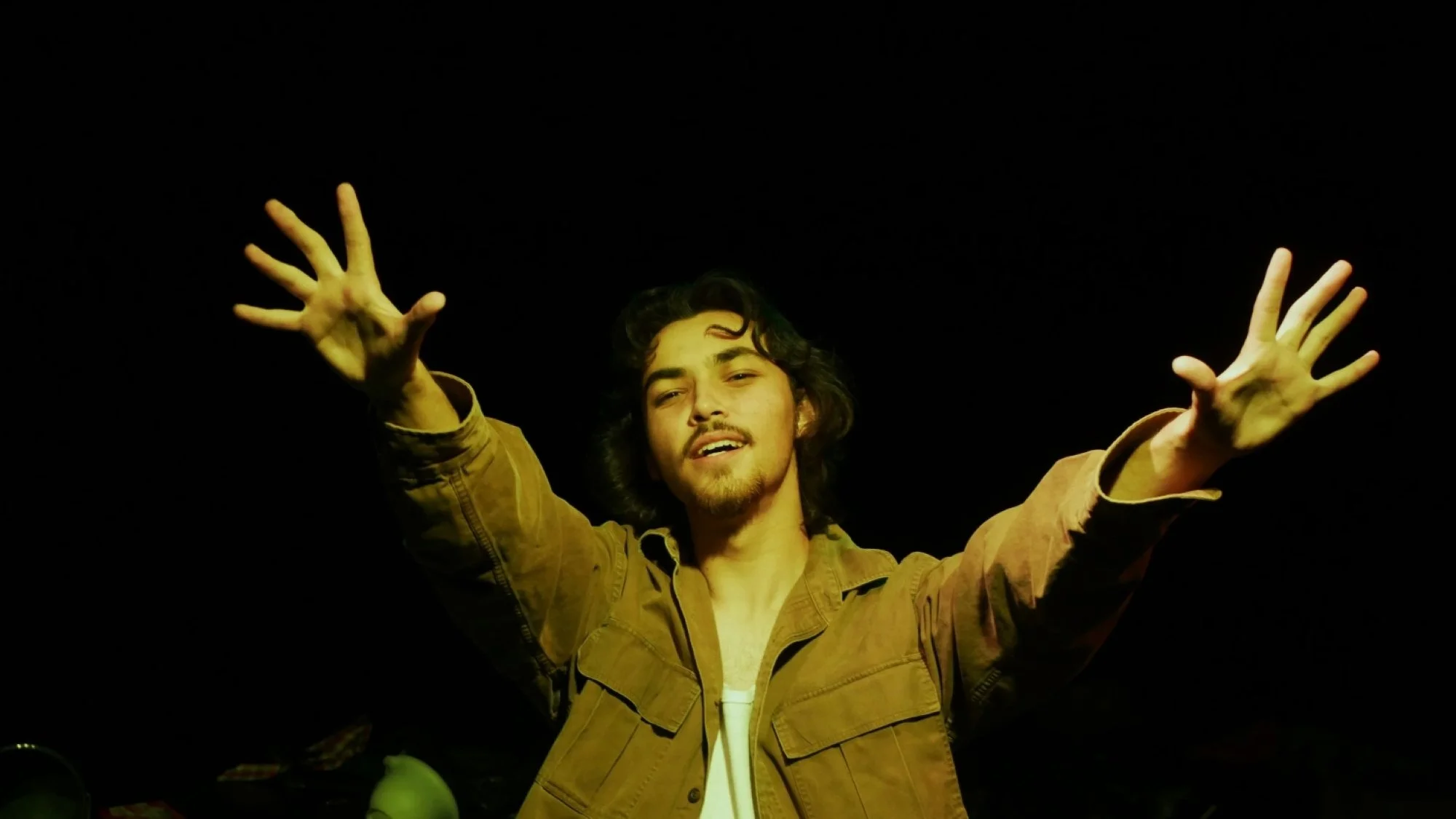 Aaron Sullivan sticking his arms out in Jax Schuck's production of Cowboy Mouth.