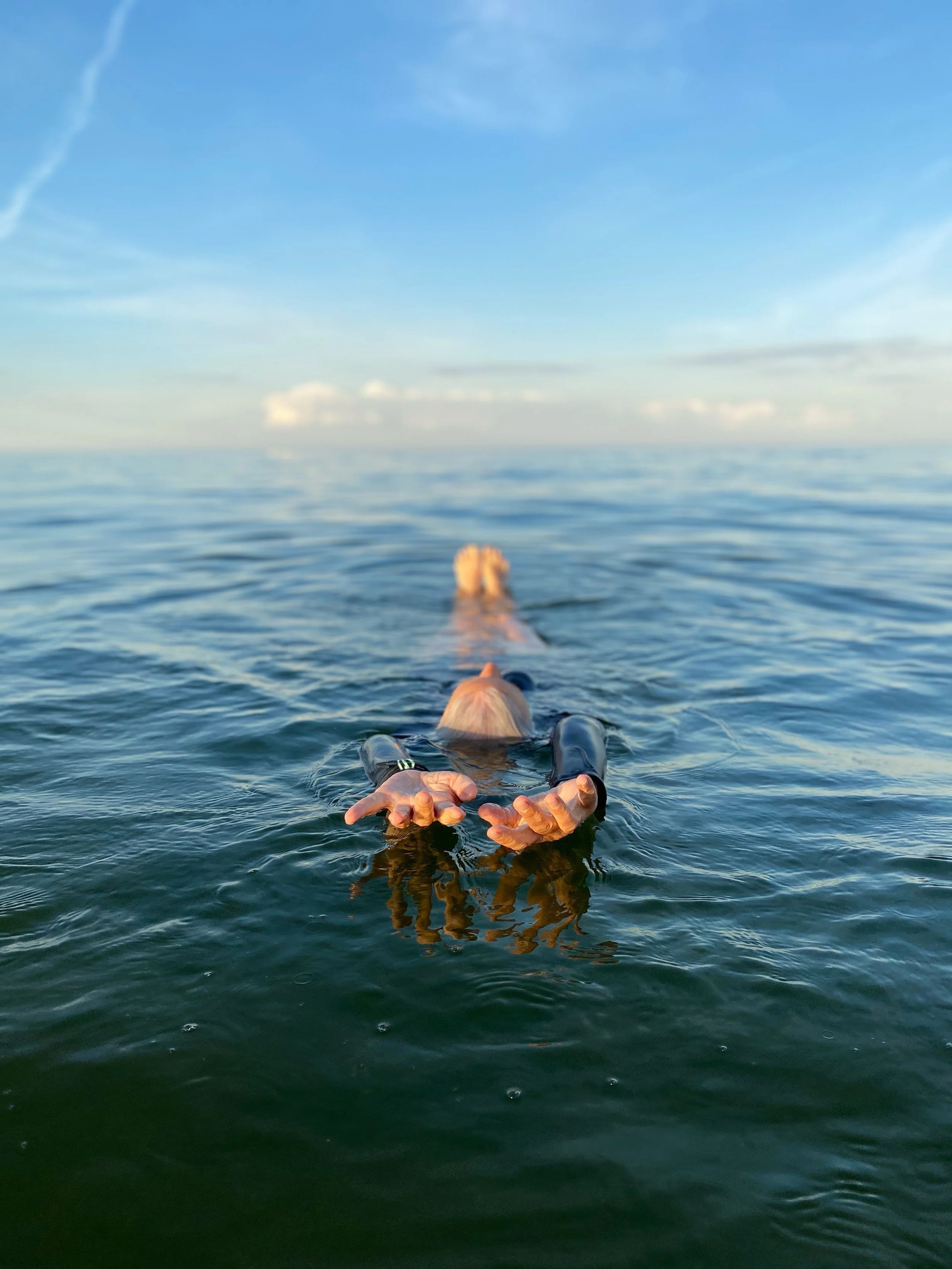 Libby DeLana floating in the ocean 