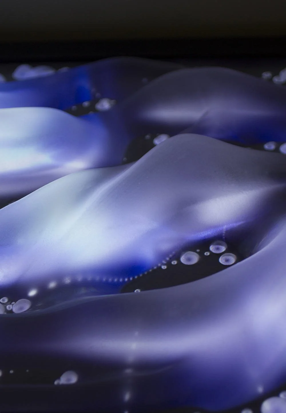 A luminous translucent surface with digital animation shining through