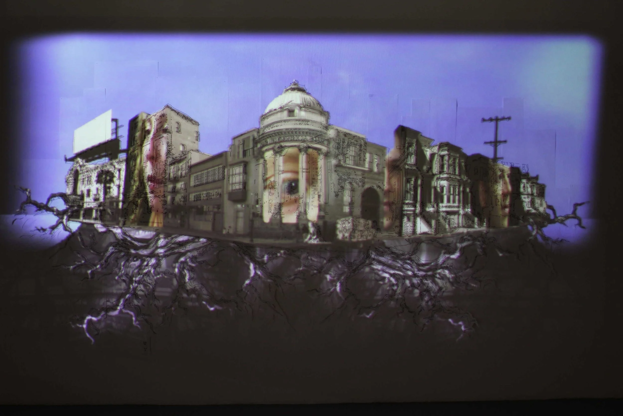 A drawing of a city block with roots growing from the bottom with video projection of faces in the buildings