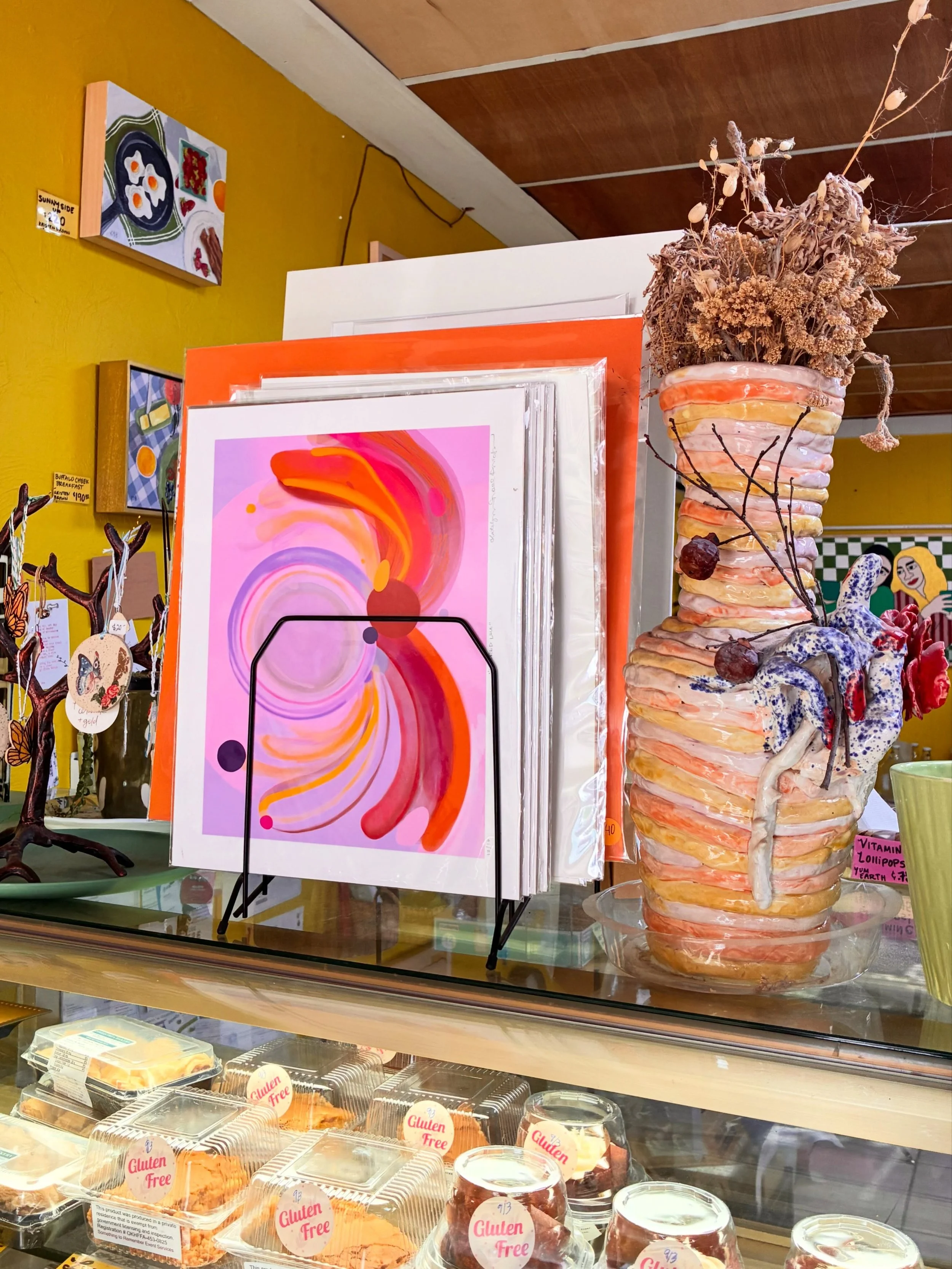 Even though the show has ended, you can still find my small originals on the shop wall as well as my prints, jewelry, and hand-painted wearables on the shelves at Flora Bodega 💛 All ready for you to collect and take home same day 🔥✨

Flora Bodega 
