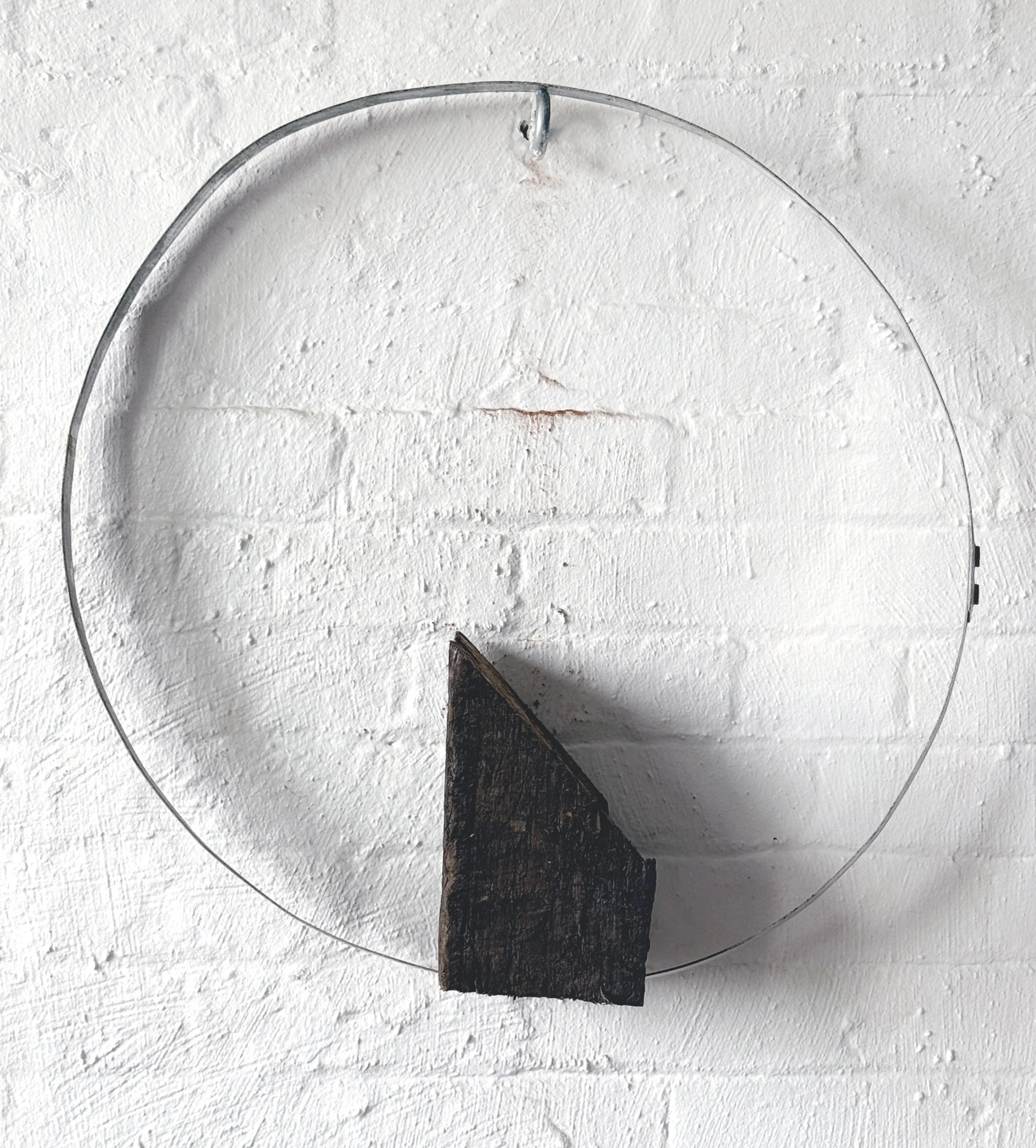 Reversing Loop (2026) | Bourbon barrel ring, portion of railroad tie & wire  | 25x24x7 in.  |  $1200