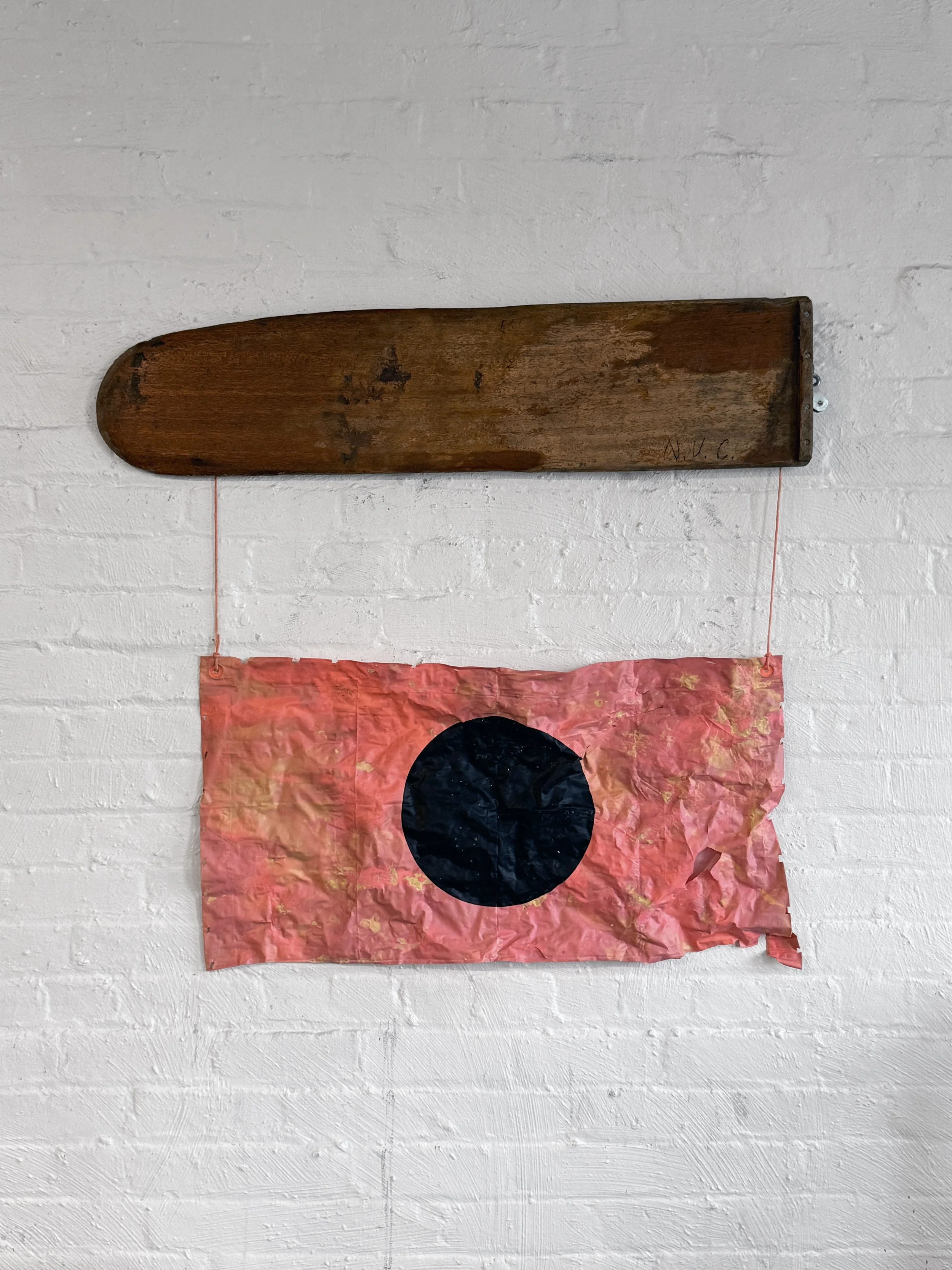 Not Under Command (2026) | Found wooden boat keel, damaged daytime distress signal, cord, graphite | 36 × 42 × 3 in.  |  $1200