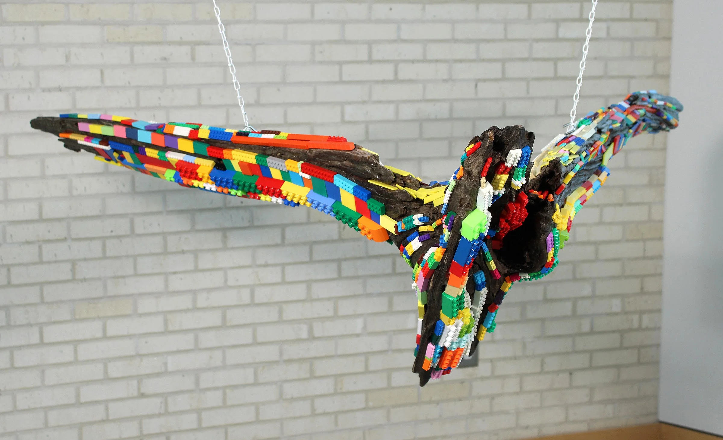 FLYING PROW, River Wood, Found Various Plastic and Wood Toy Bricks, E6000, 21”H x 67”W x 72”D, Suspended, 2026