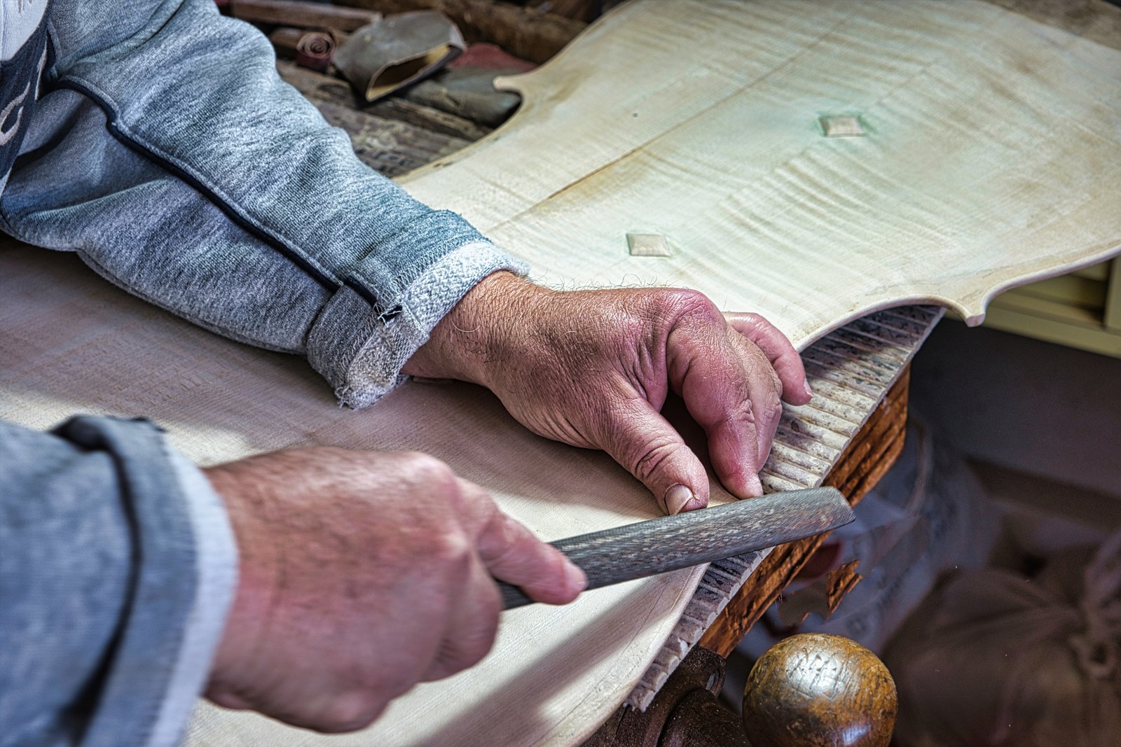 A luthier works his craft in Cremona