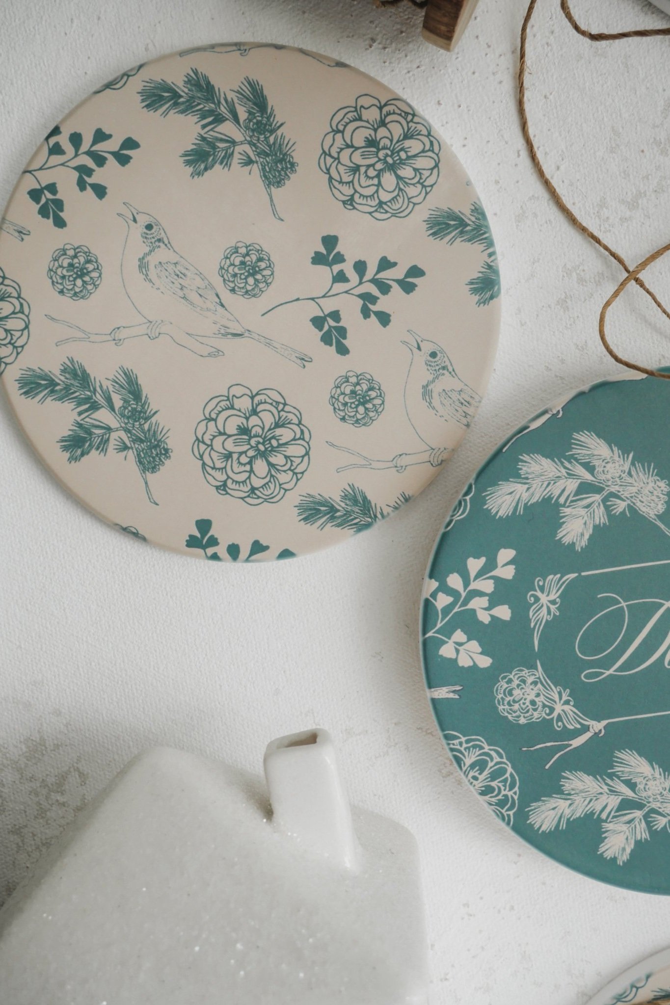 Sage and beige coasters with birds, leaves, and flowers