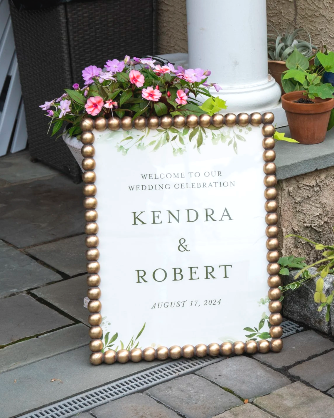 calligraphy sign for wedding with a gold frame