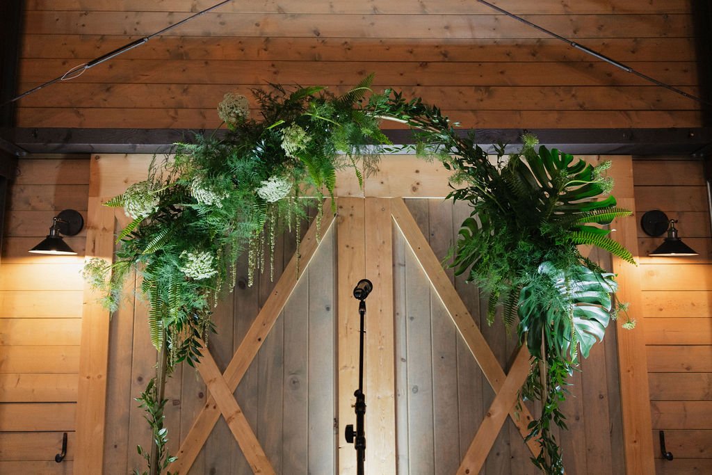 wedding arbor seattle greenery and monstera