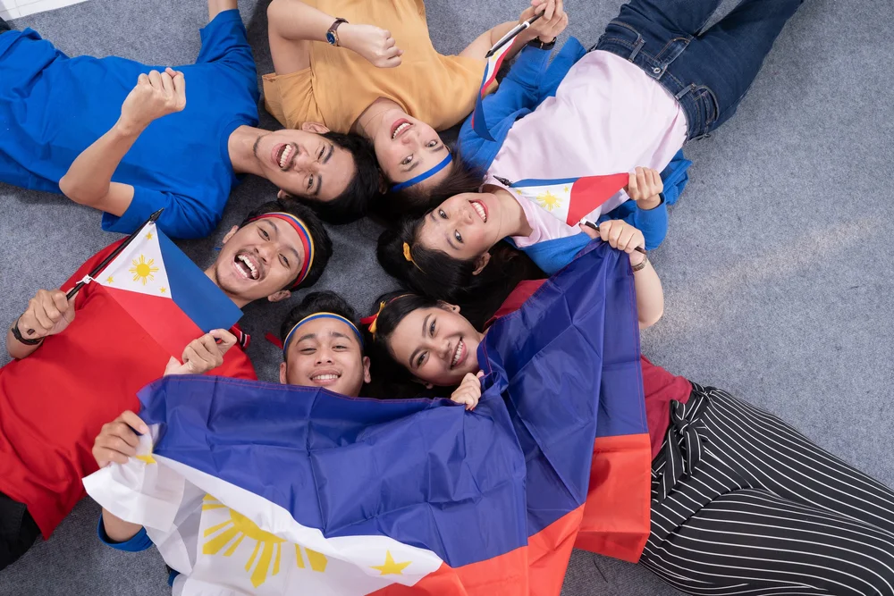 Young Filipino Americans with the Philippine flag