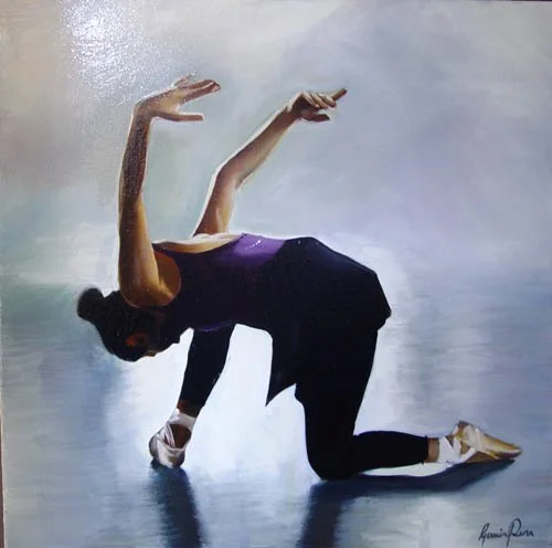 A woman with long dark hair performing a yoga pose on a smooth, light-colored surface.