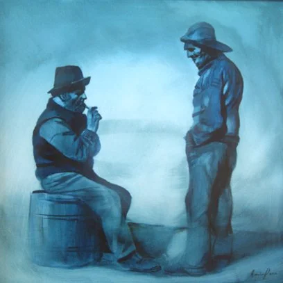 Two people wearing hats, one sitting on a barrel and the other standing, engaged in conversation against a plain background.