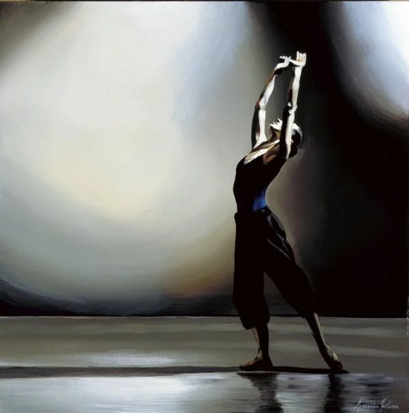 A person in a black outfit performing a dance or yoga pose with arms raised above head, background features large abstract black and gray shapes.