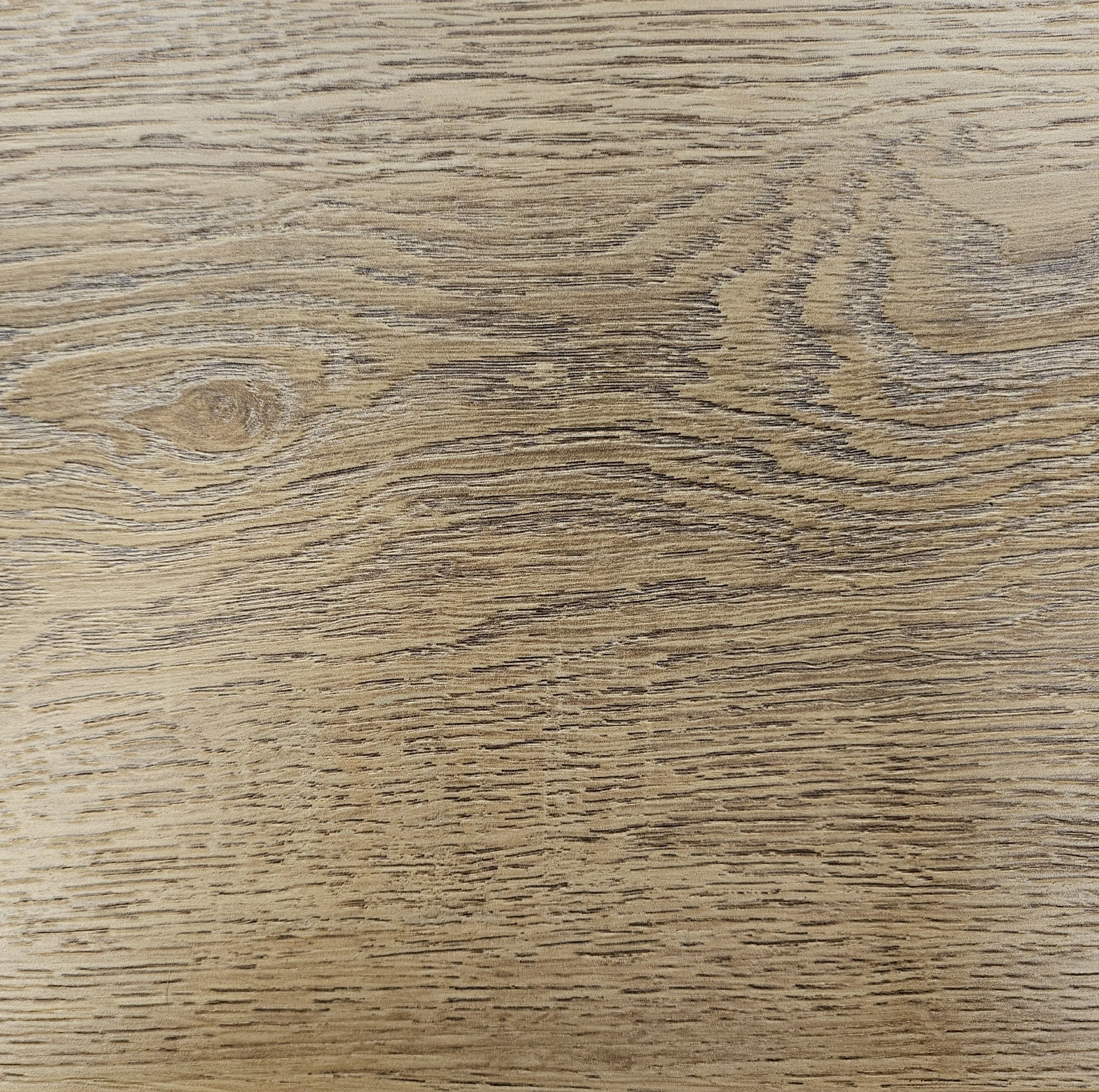 Close-up of a wooden surface with visible wood grain patterns.