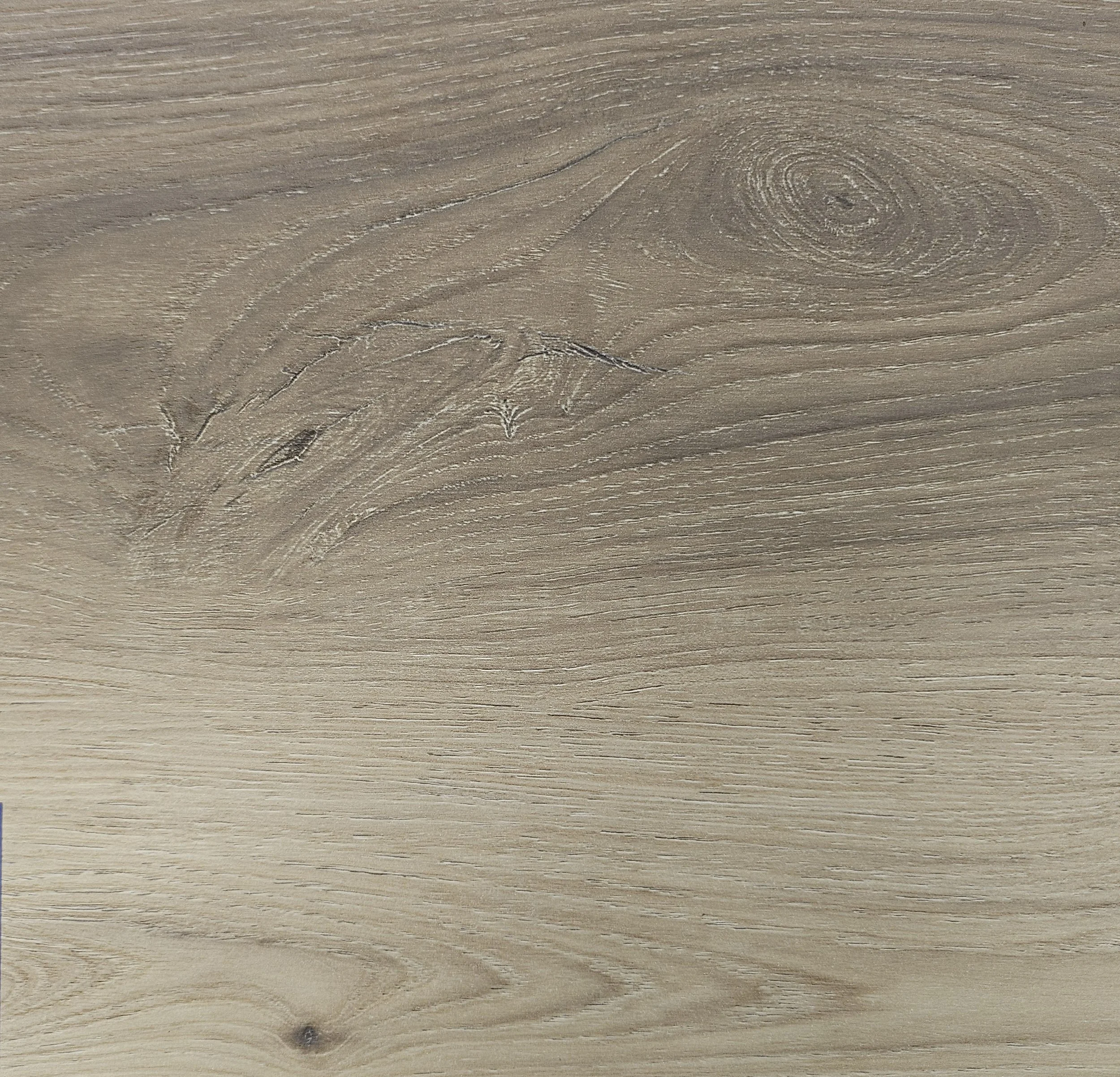 Close-up photo of a wooden surface showing natural wood grain patterns and knots.