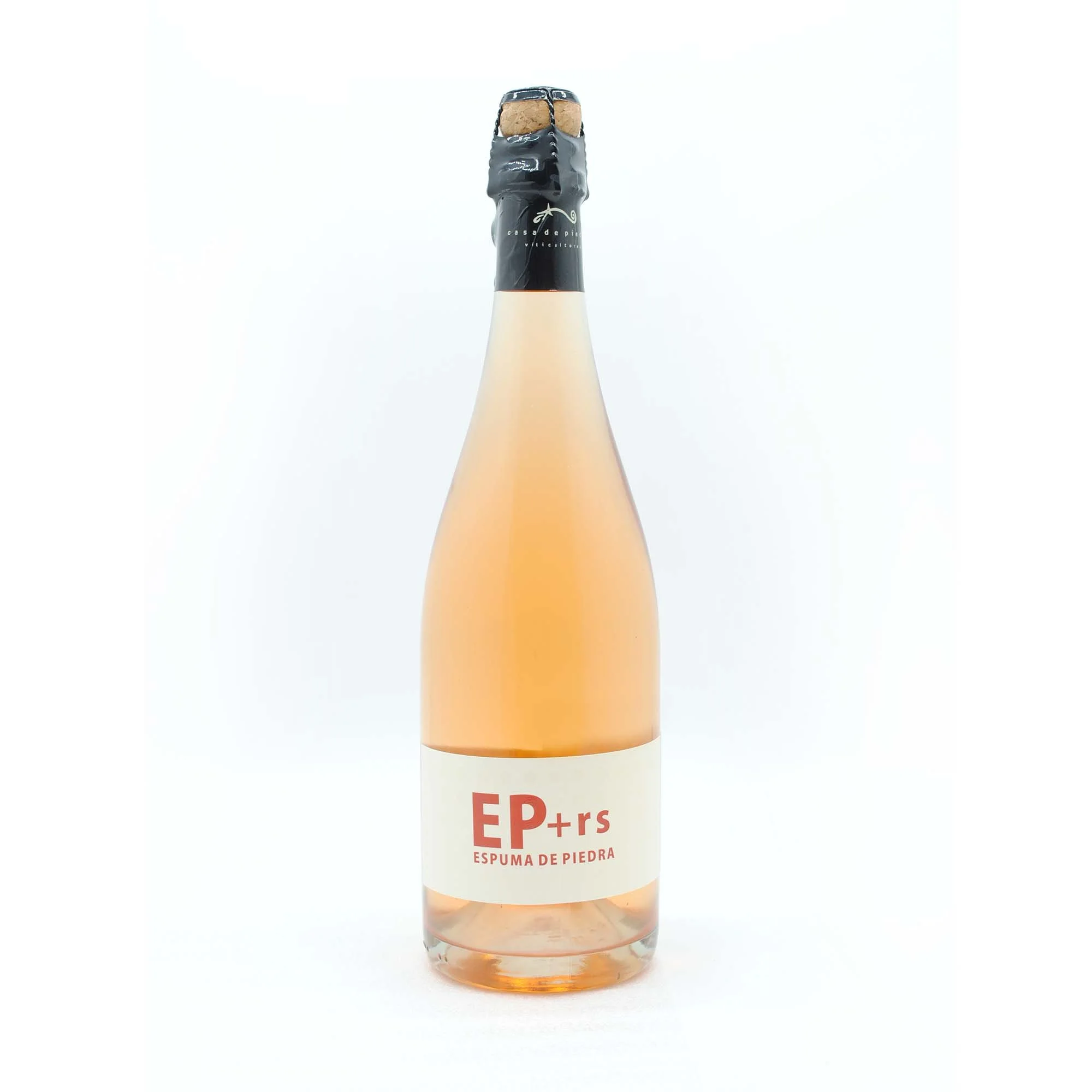 A bottle of sparkling rosé wine labeled 'EP + rs Espuma de Piedra' with a black foil seal on the cork, against a plain white background.