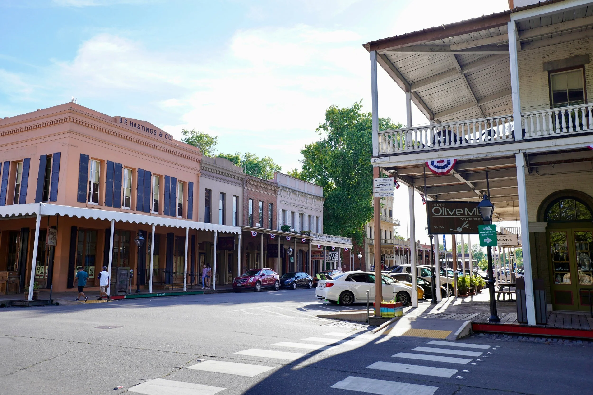 A streetscape in Old Sacramento. The Wild West, gold rush buildings are covered in red, white and blue bunting