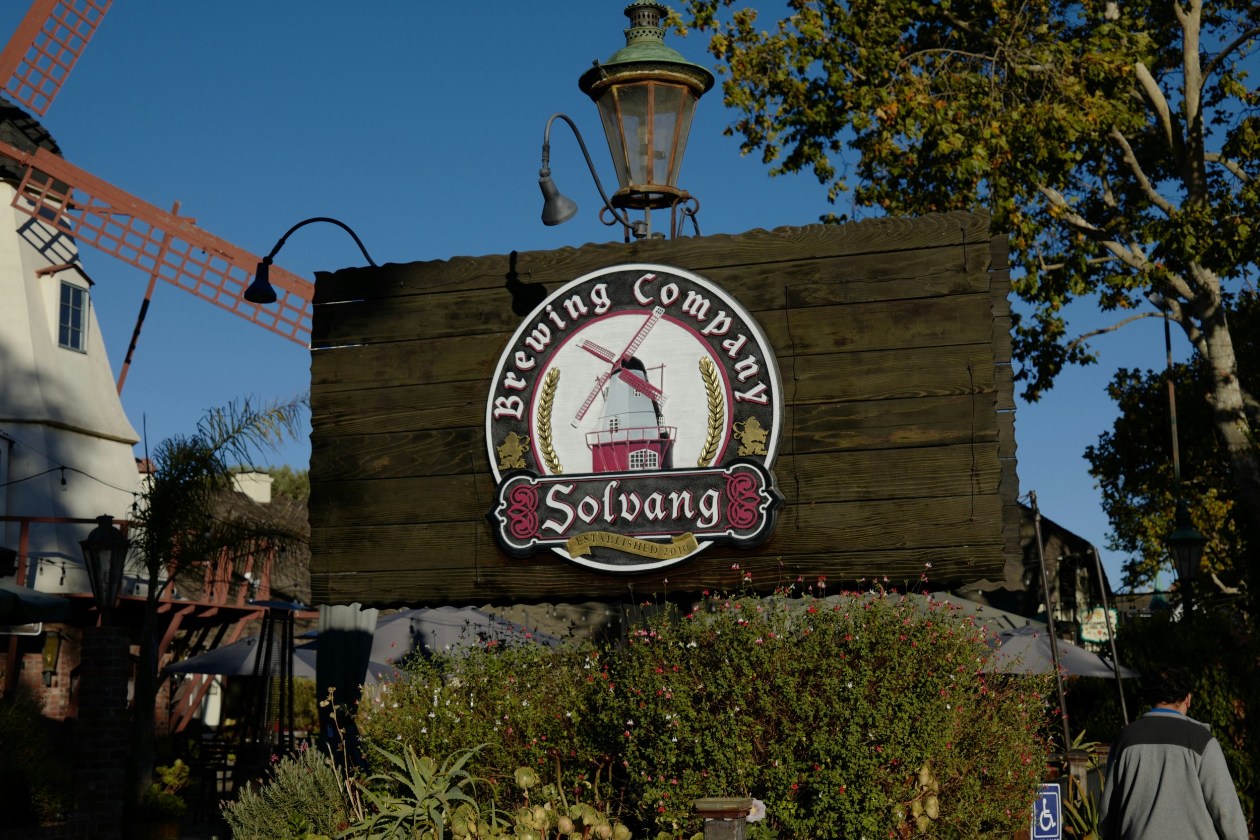 A sign for the Solvang Brewing Company, showing a windmill