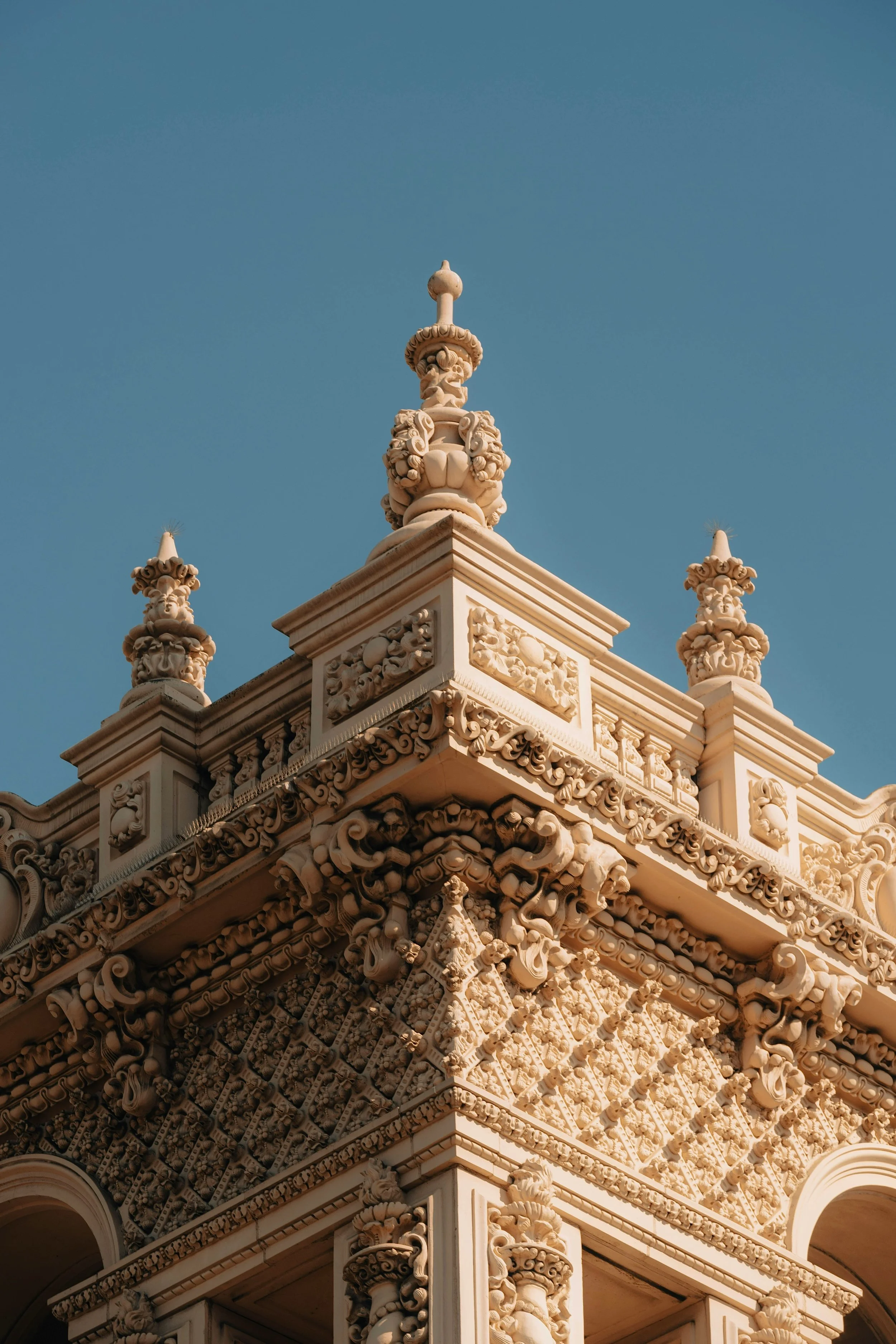 A detail of one of the Spanish Revival buildings in Balboa Park. The frieze is incredibly intricate, patterned and contains stone flowers