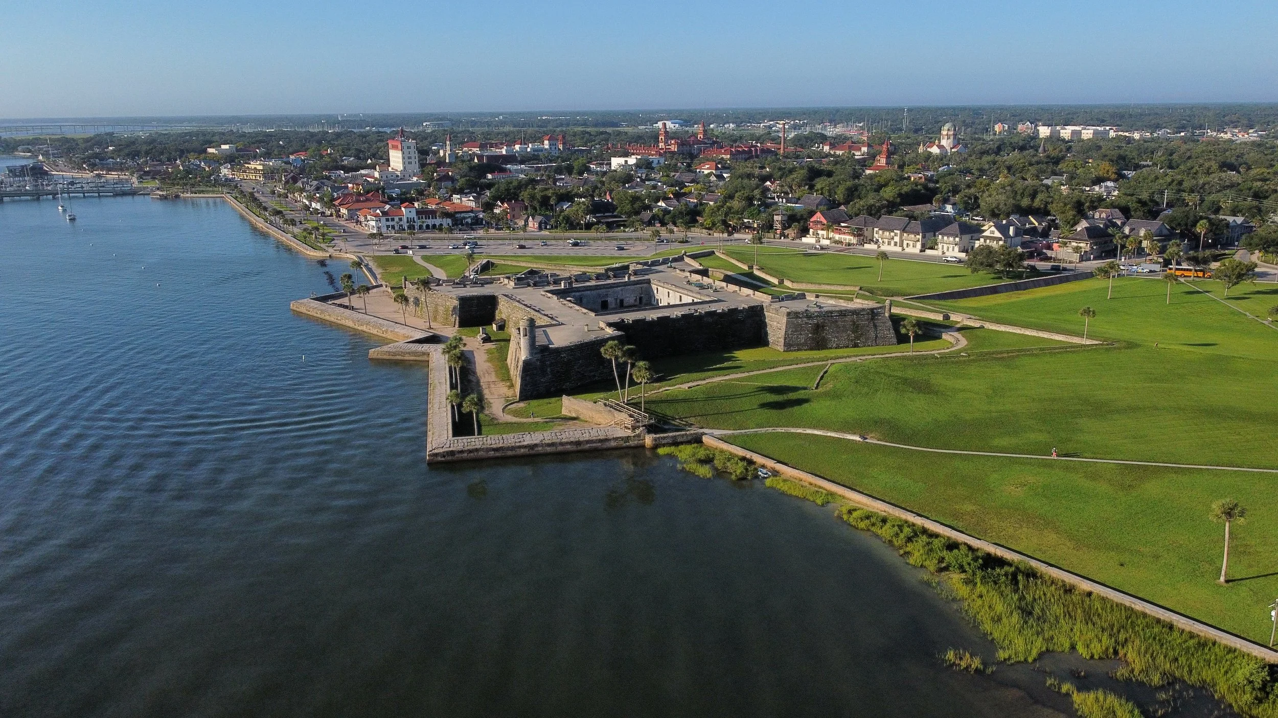 An aerial shot of Castillo de San Marcos with the city of St. Augstine in the background