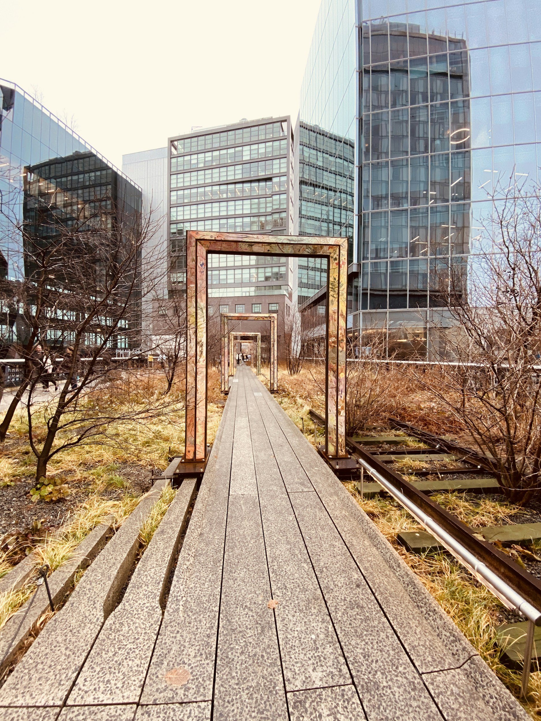 A path in the New York High Line passes through a series of door frames