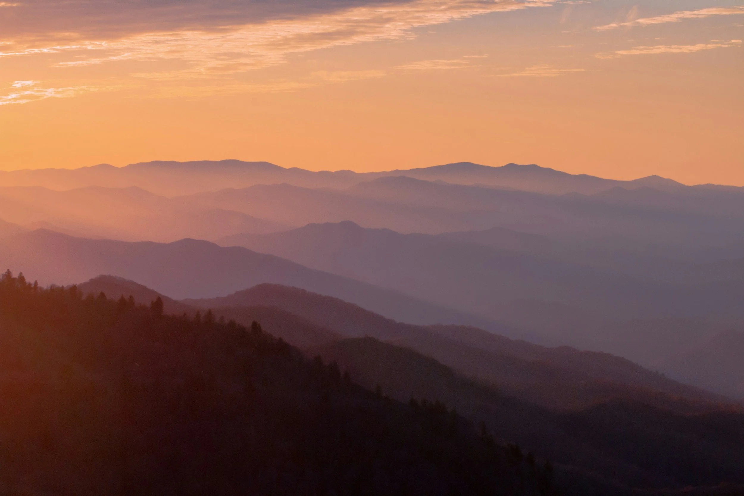The sun sets though the Blue Ridge Mountains as seen from Skyline Drive.