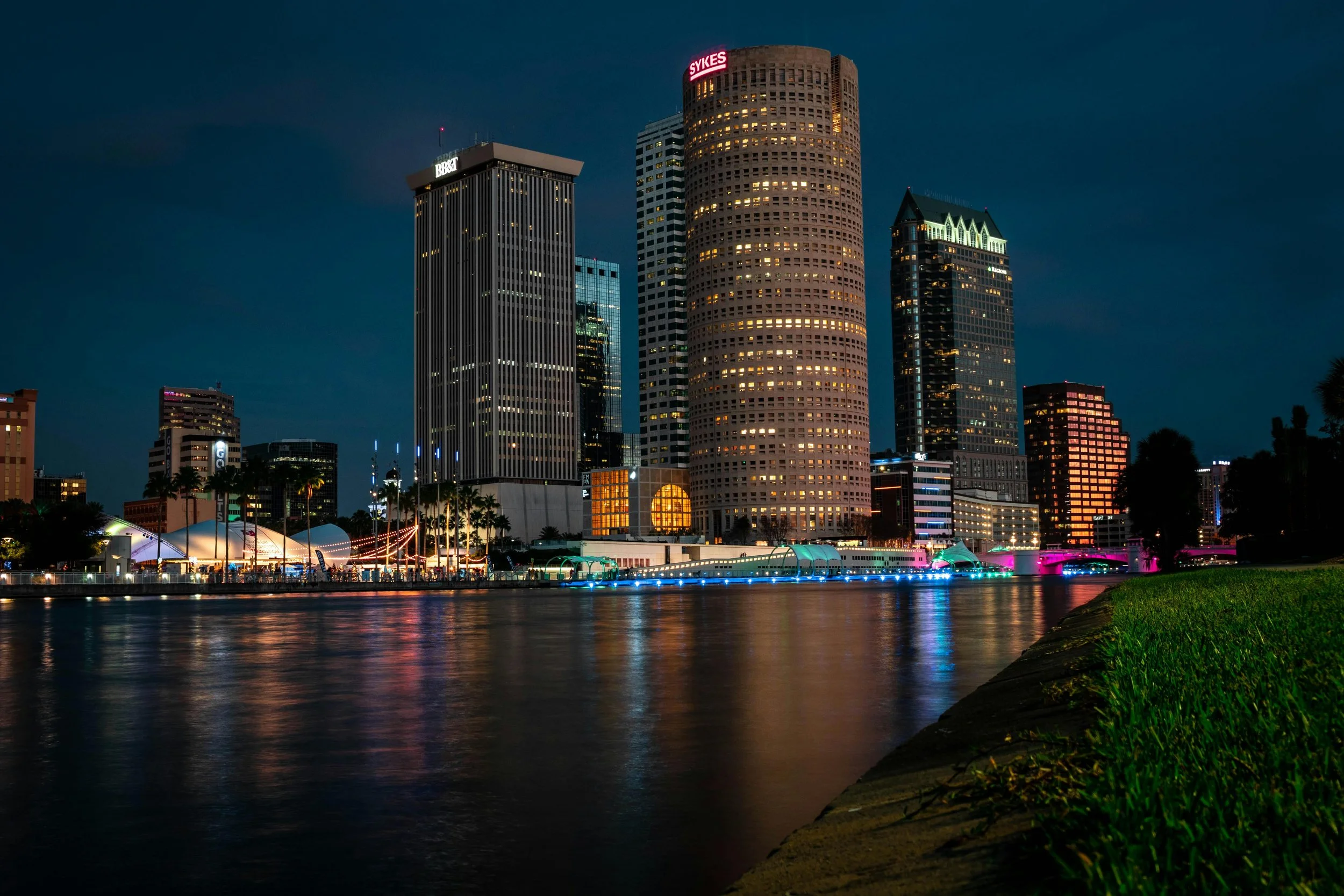 The reflection of skyscrapers can be seen in a body of water in Tampa, Florida