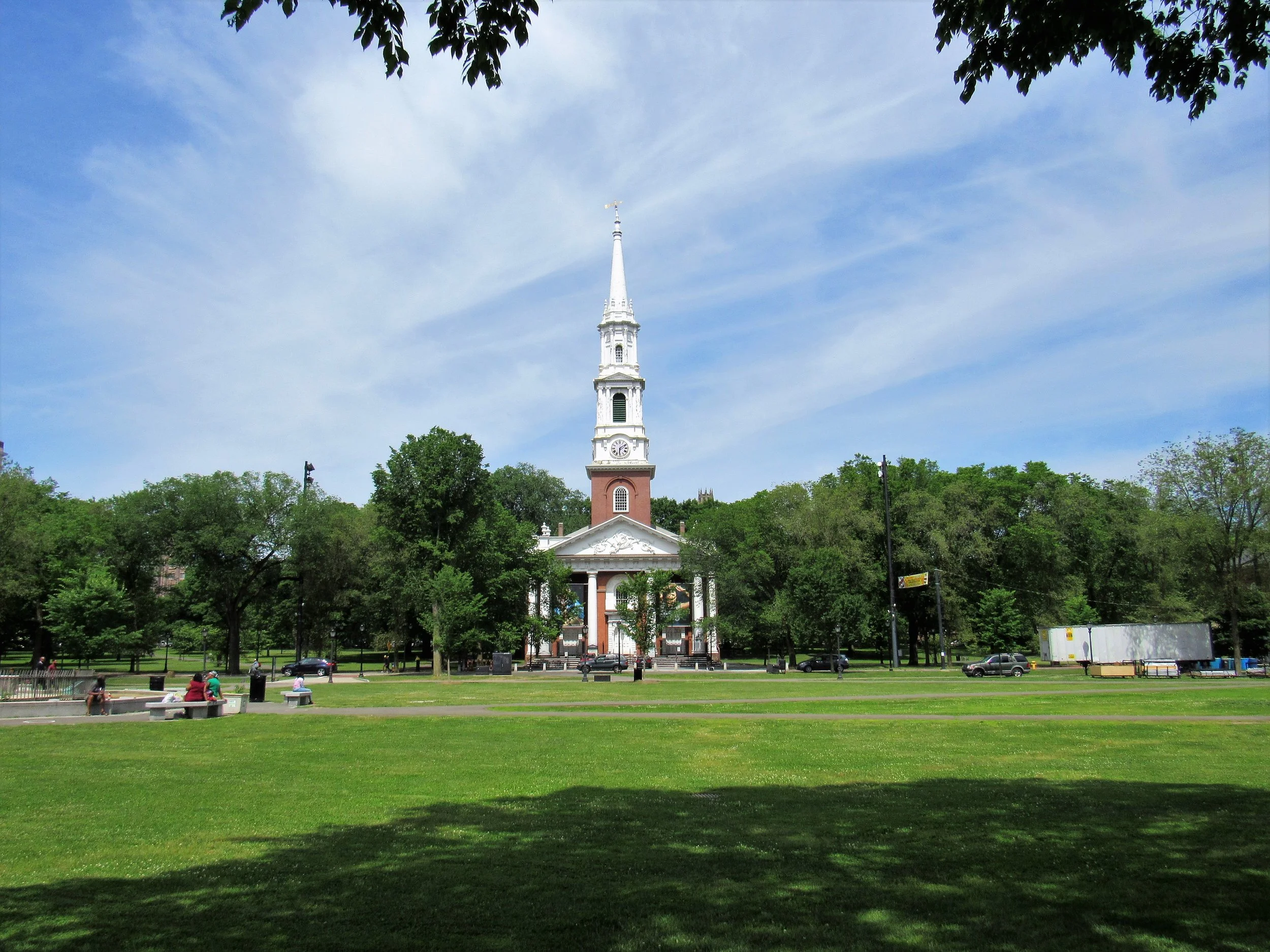 A small church with a huge white spire sits on New Haven Green. Drives & Detours  self-guided Yale campus tour
